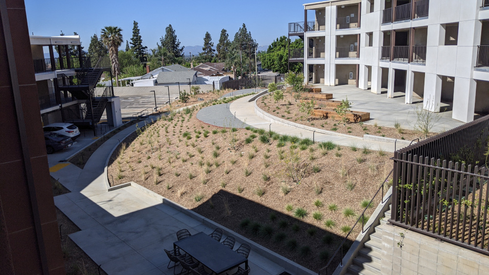 Woodchip terraces for plants - covered parking lot