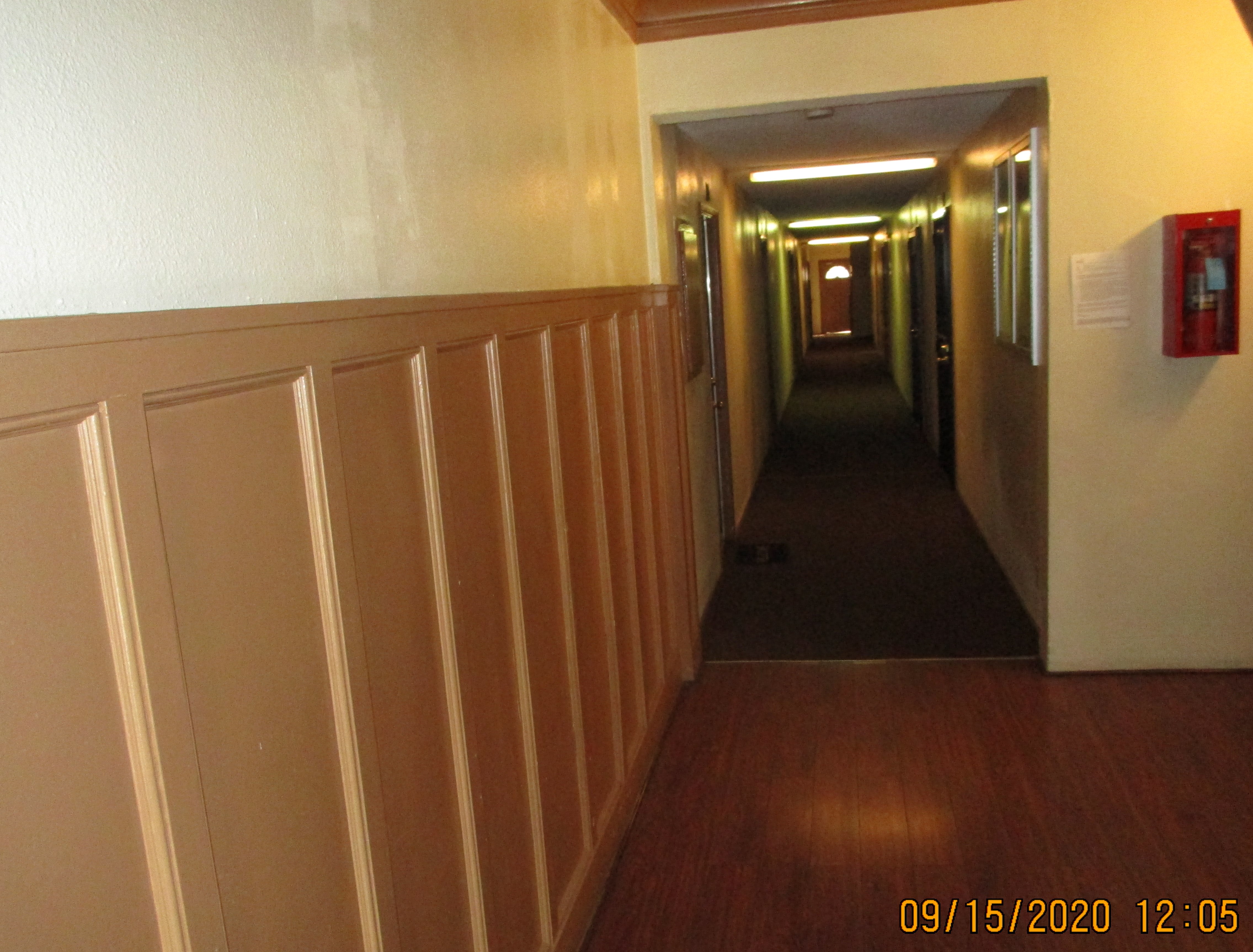 Concord A&B building. long building hallway. fire extinguisher mounted on wall