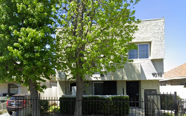 Exterior view of wadsworth park. A tree in front of a two story building.