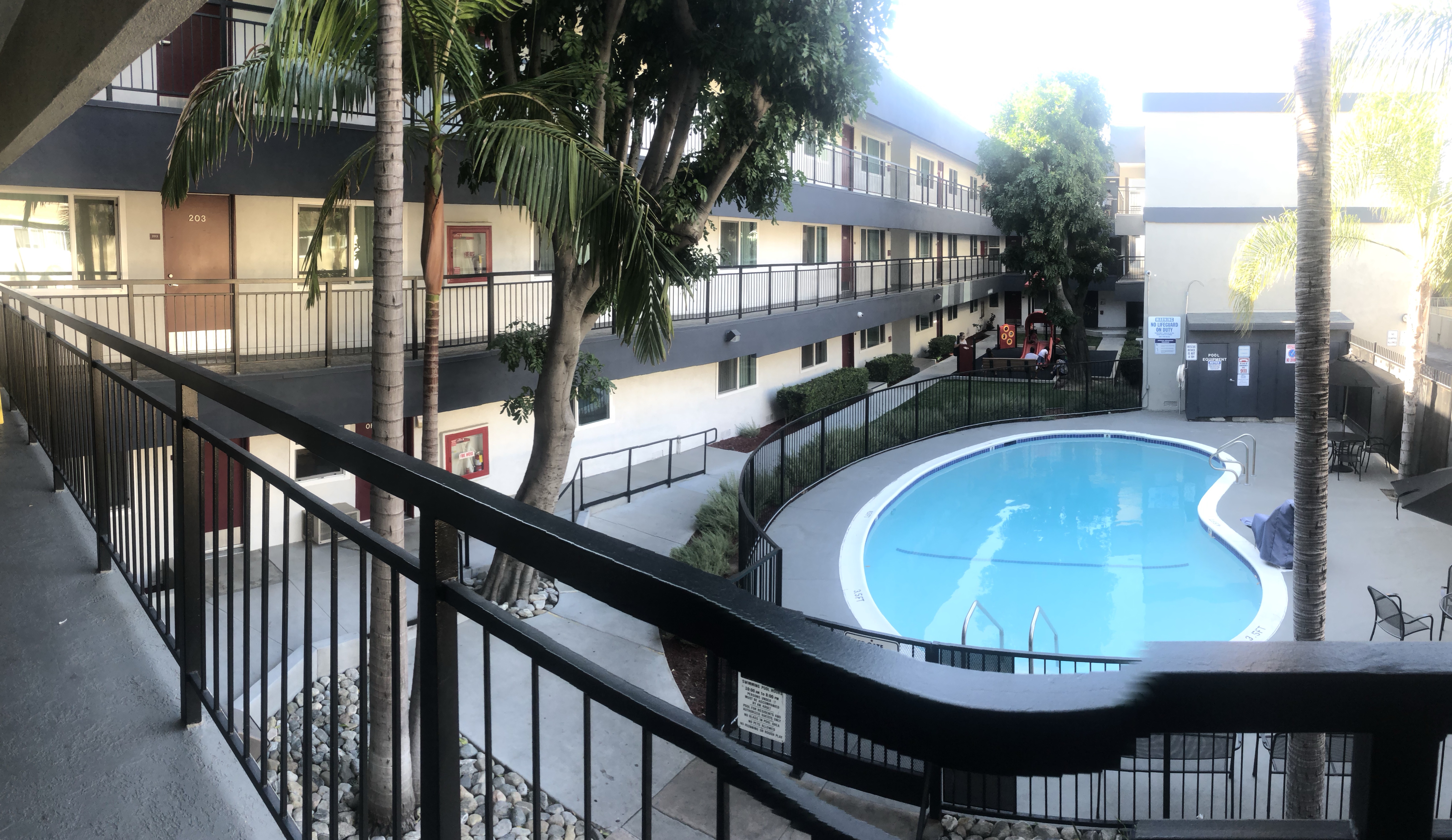 View of the building pool from apartment balcony