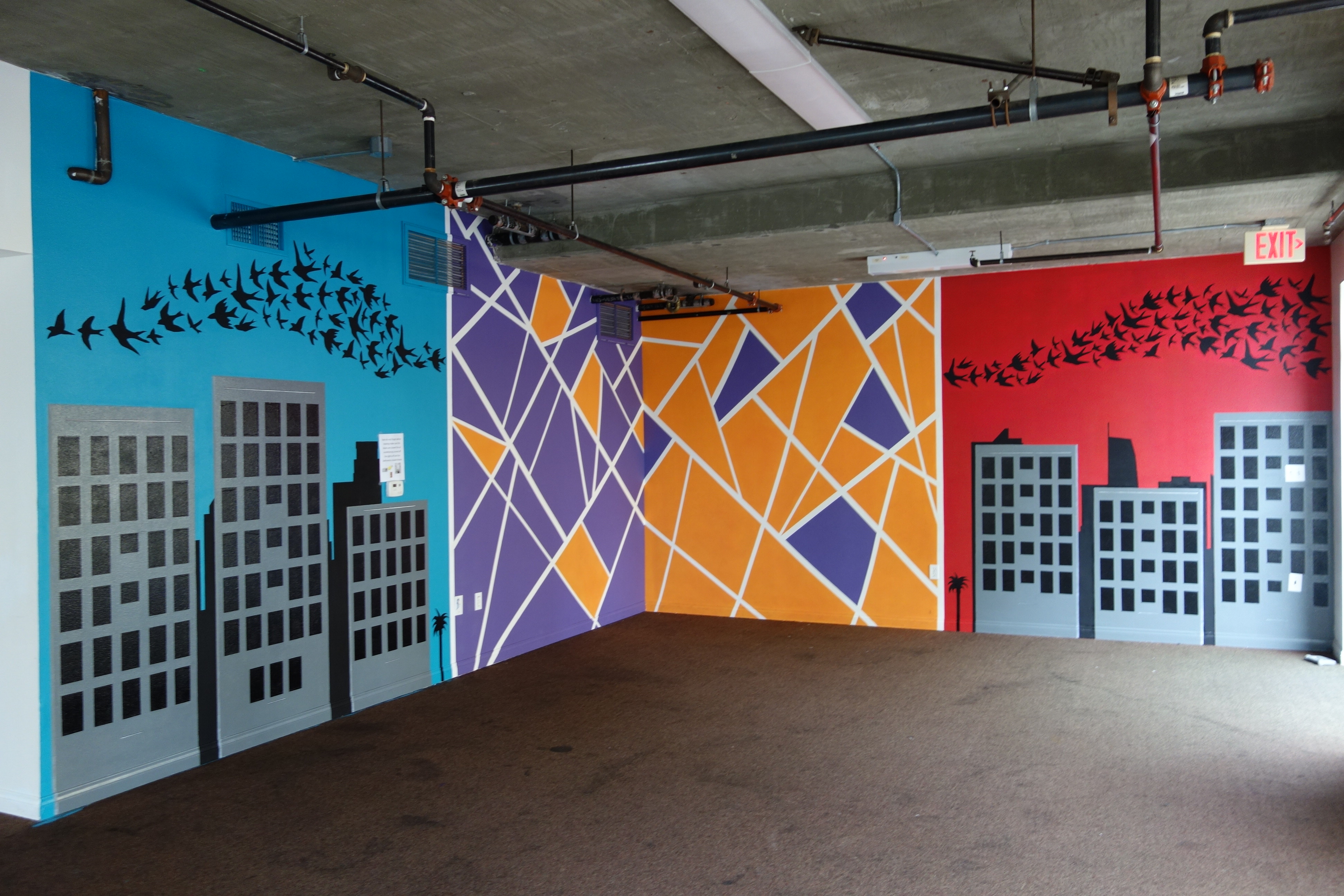 Image of three different connected murals at James Wood Apartments