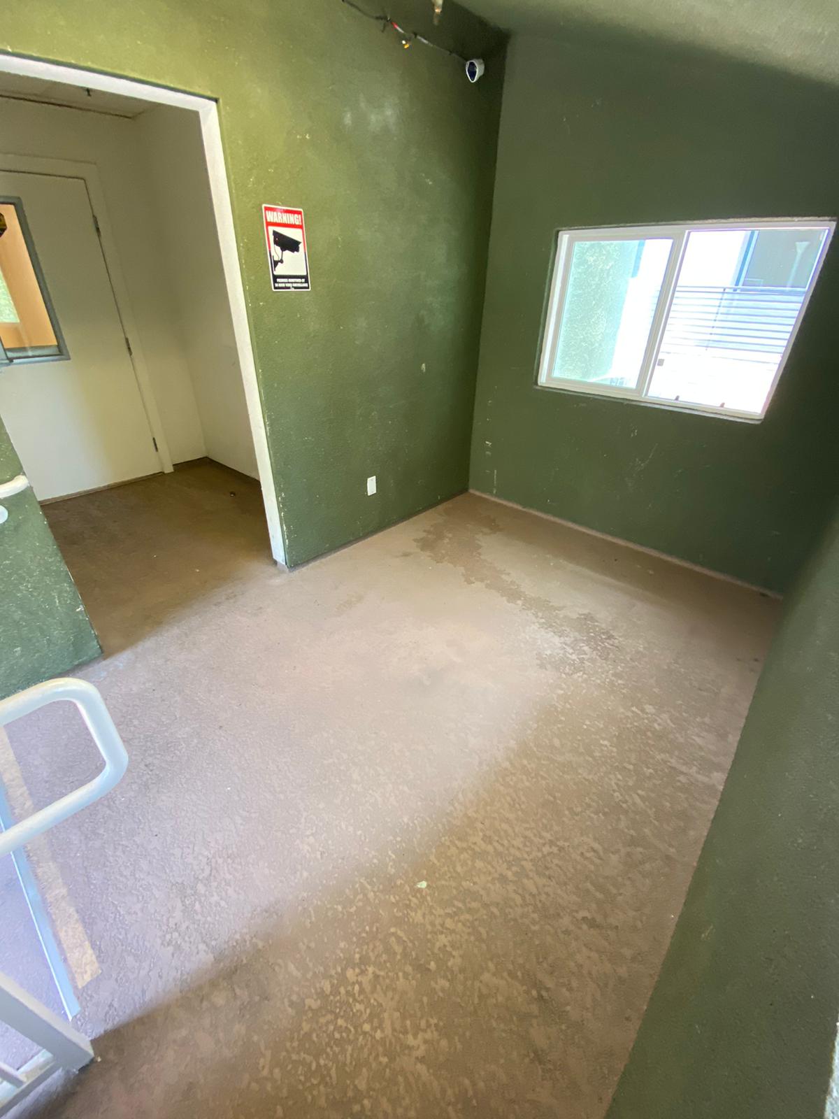 image of area at Klump. small area or hall with window and security camera
