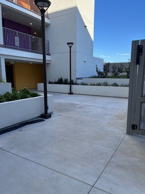 Photo of courtyard showing flower beds.