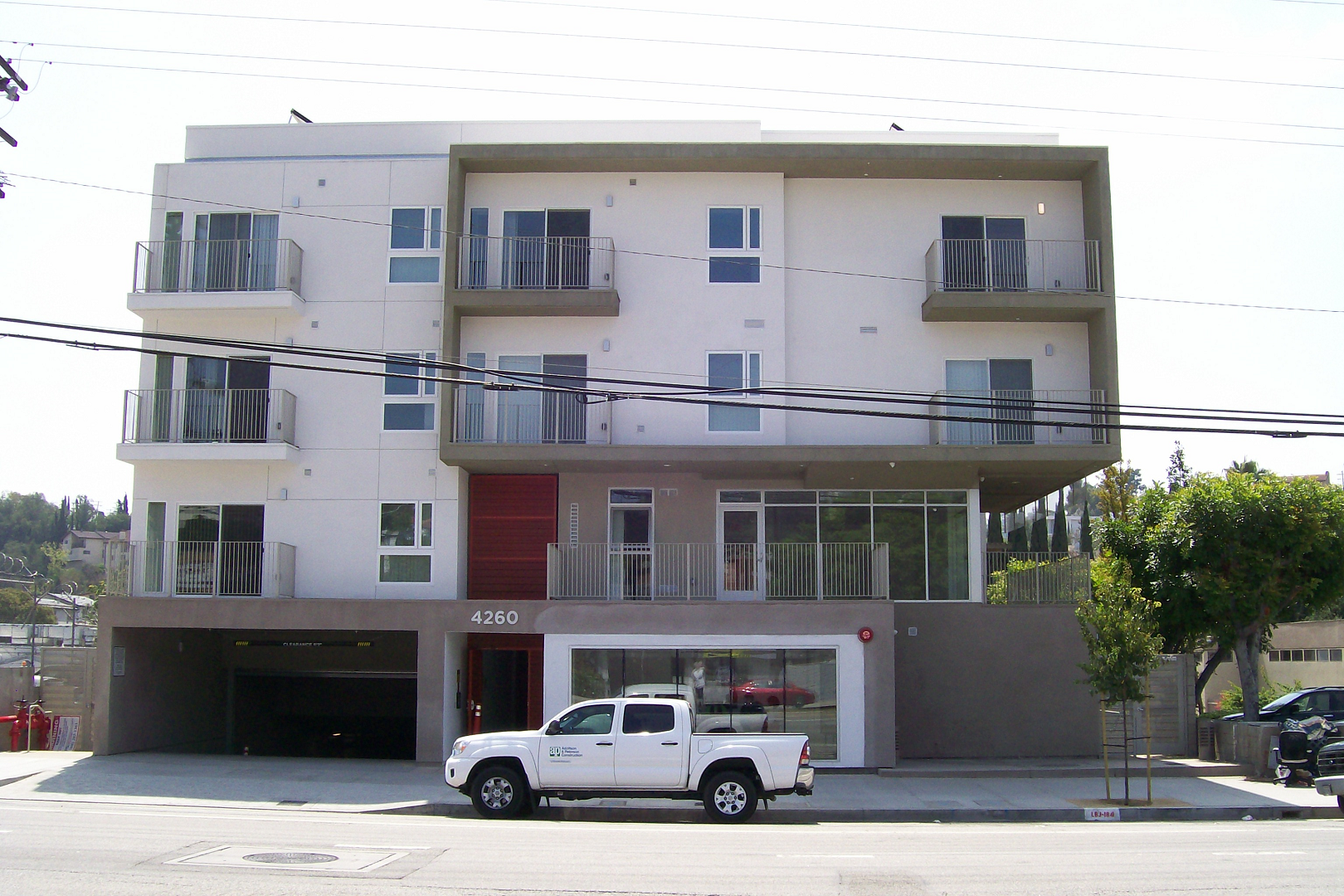 front street view of four story building. Underground parking lor and street parking. Units with balcony access.