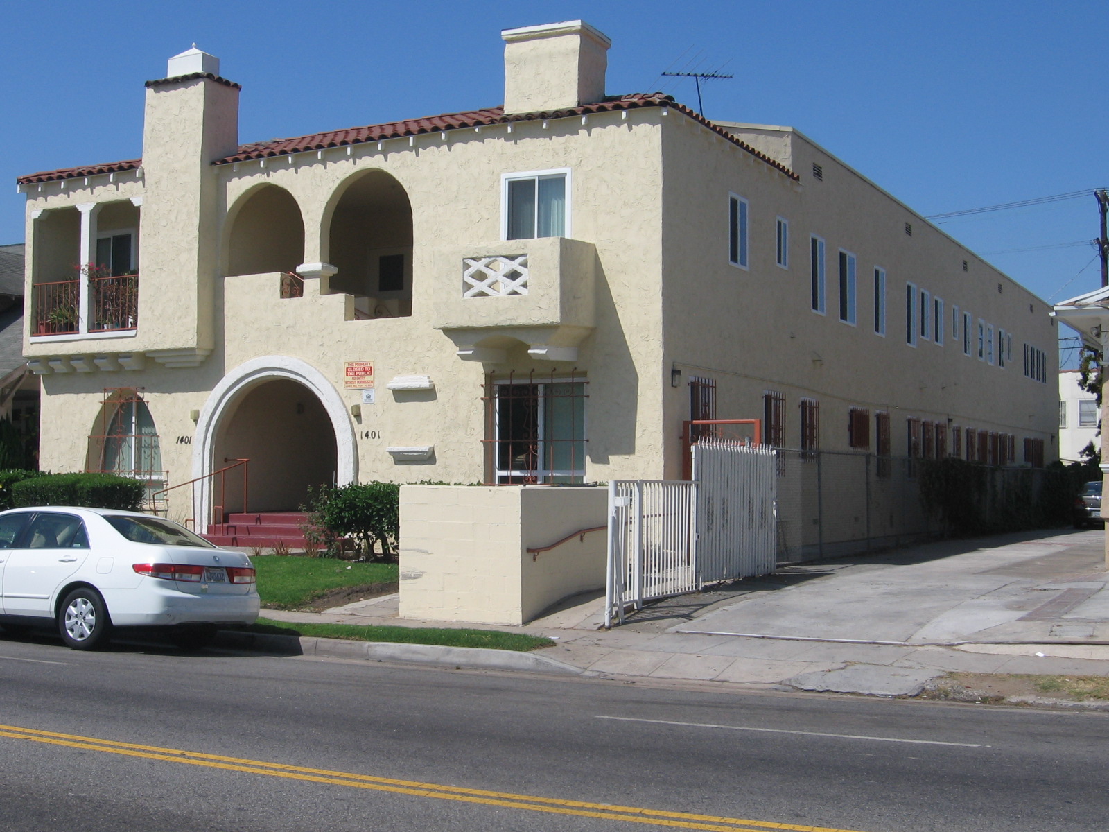 Front view of a two floor building with a front entrance