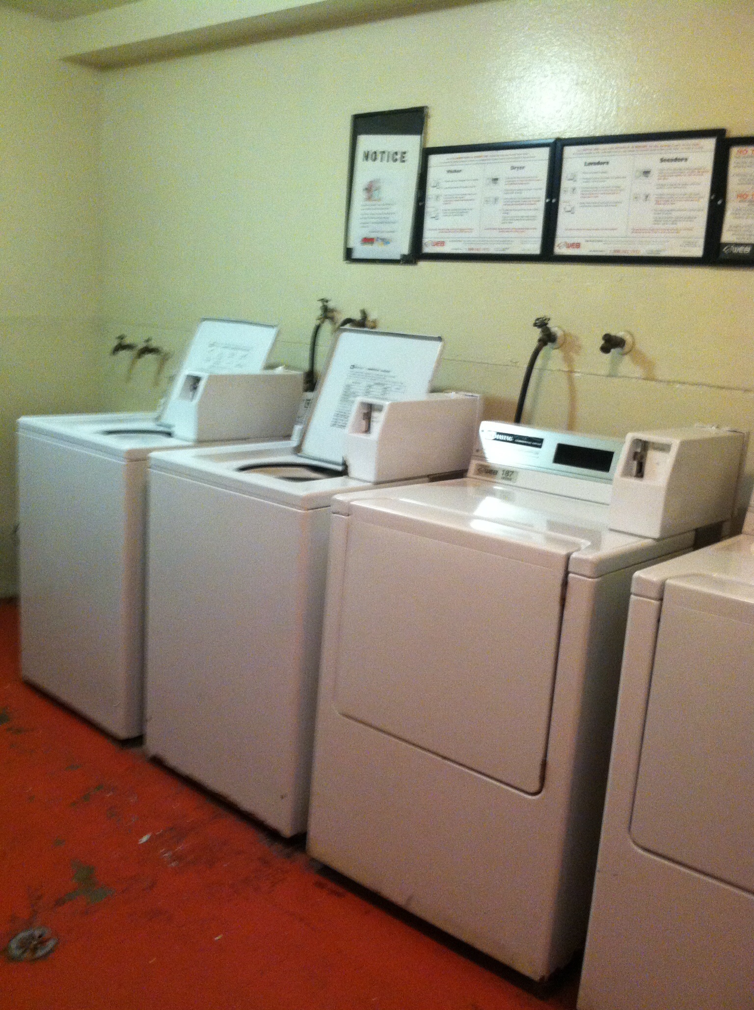 Interior view of a laundry room at Ingram Preservation Properties showing two washers and dryers