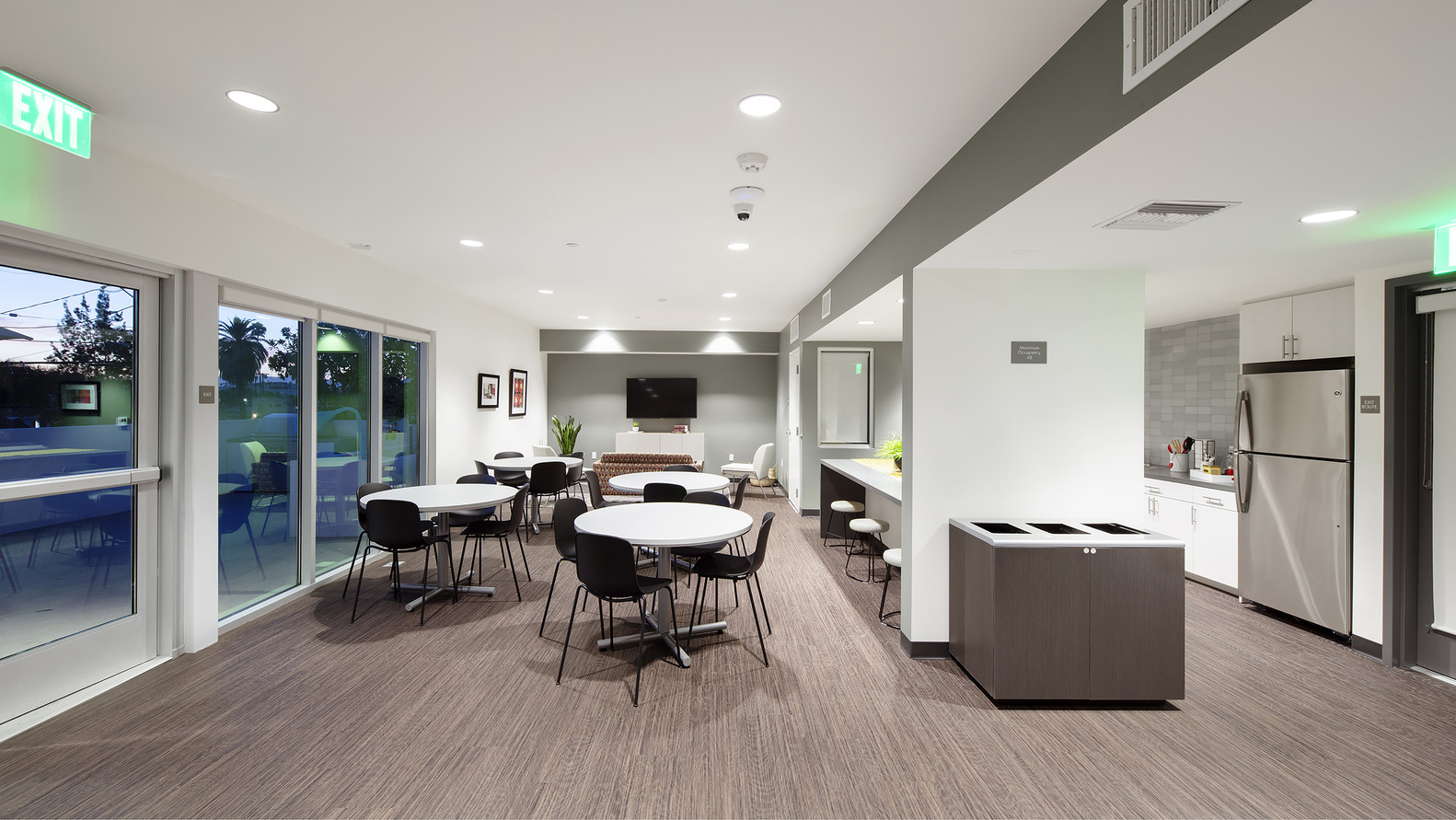 Community Room with tables and a kitchen area