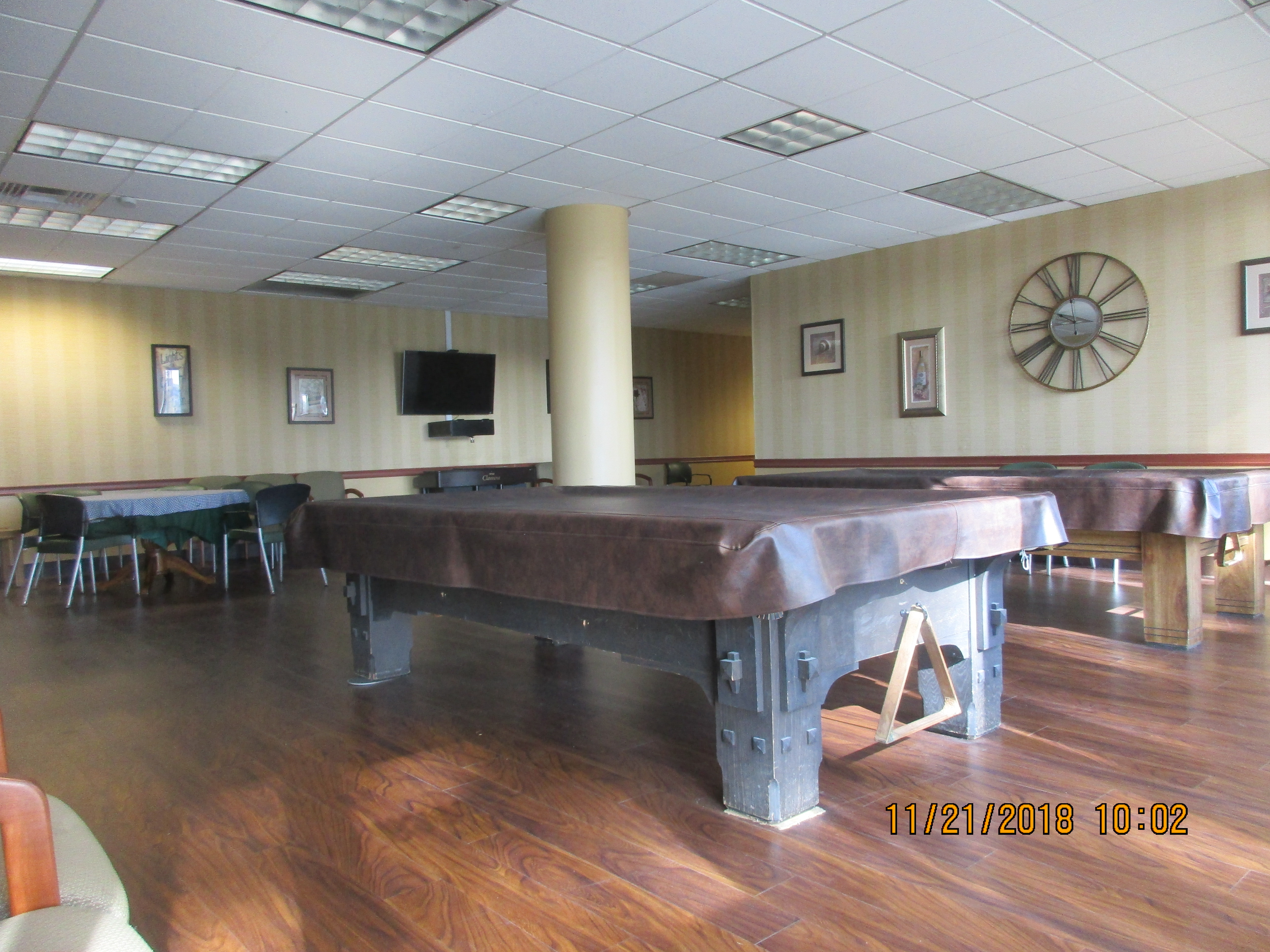 Front view of the apartment common room equipped with pool tables