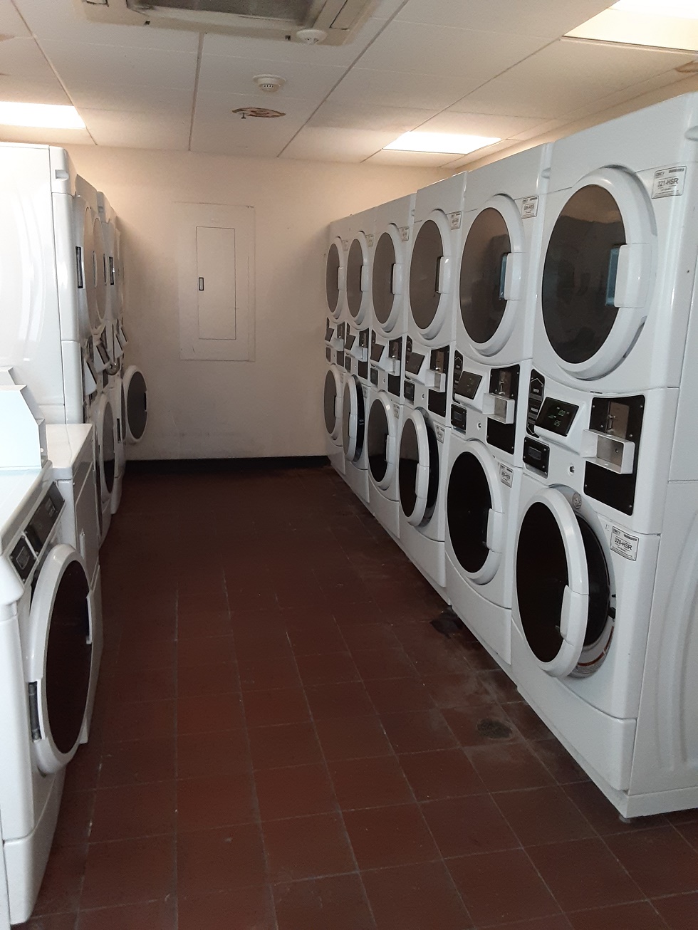 gateway apartments laundry room. large laundry room with stacked machines.