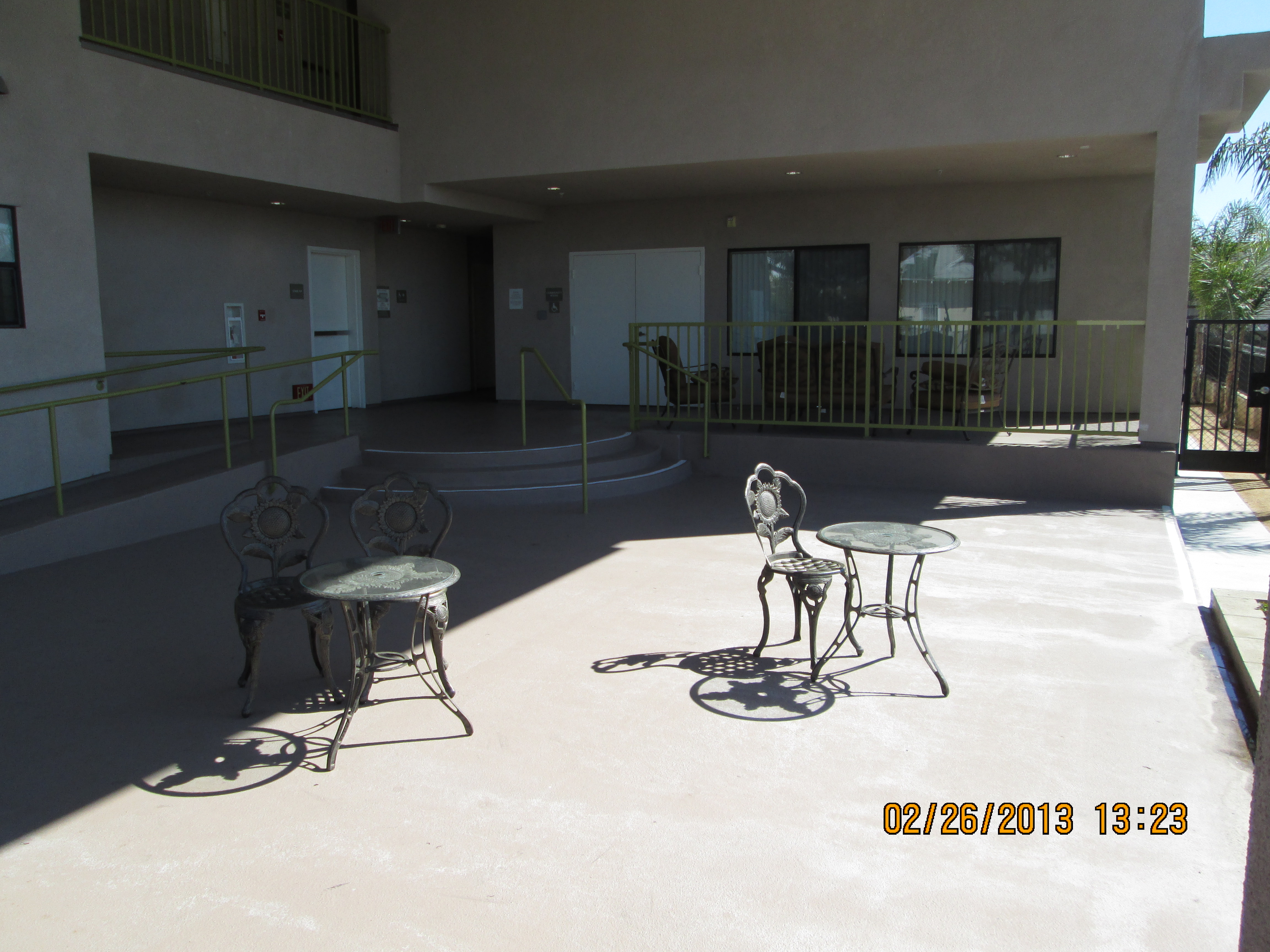 Exterior view of the patio area of Las Margaritas showing two small round tables with chairs