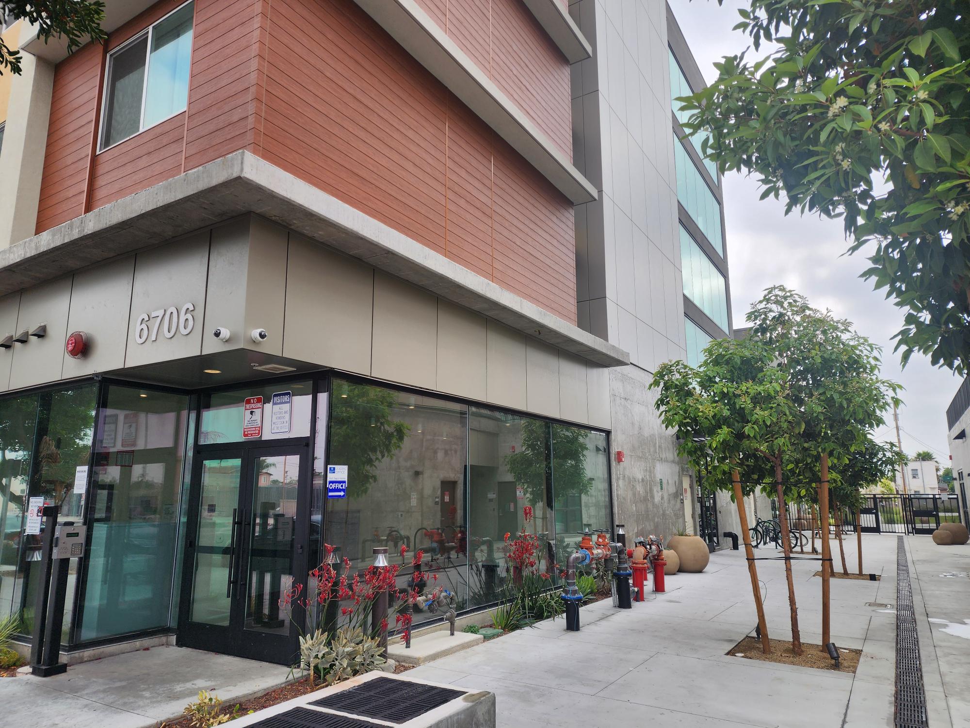 Photo of Bldg exterior and unit kitchen