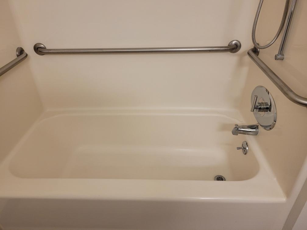 Image of bathtub  with grab bars.