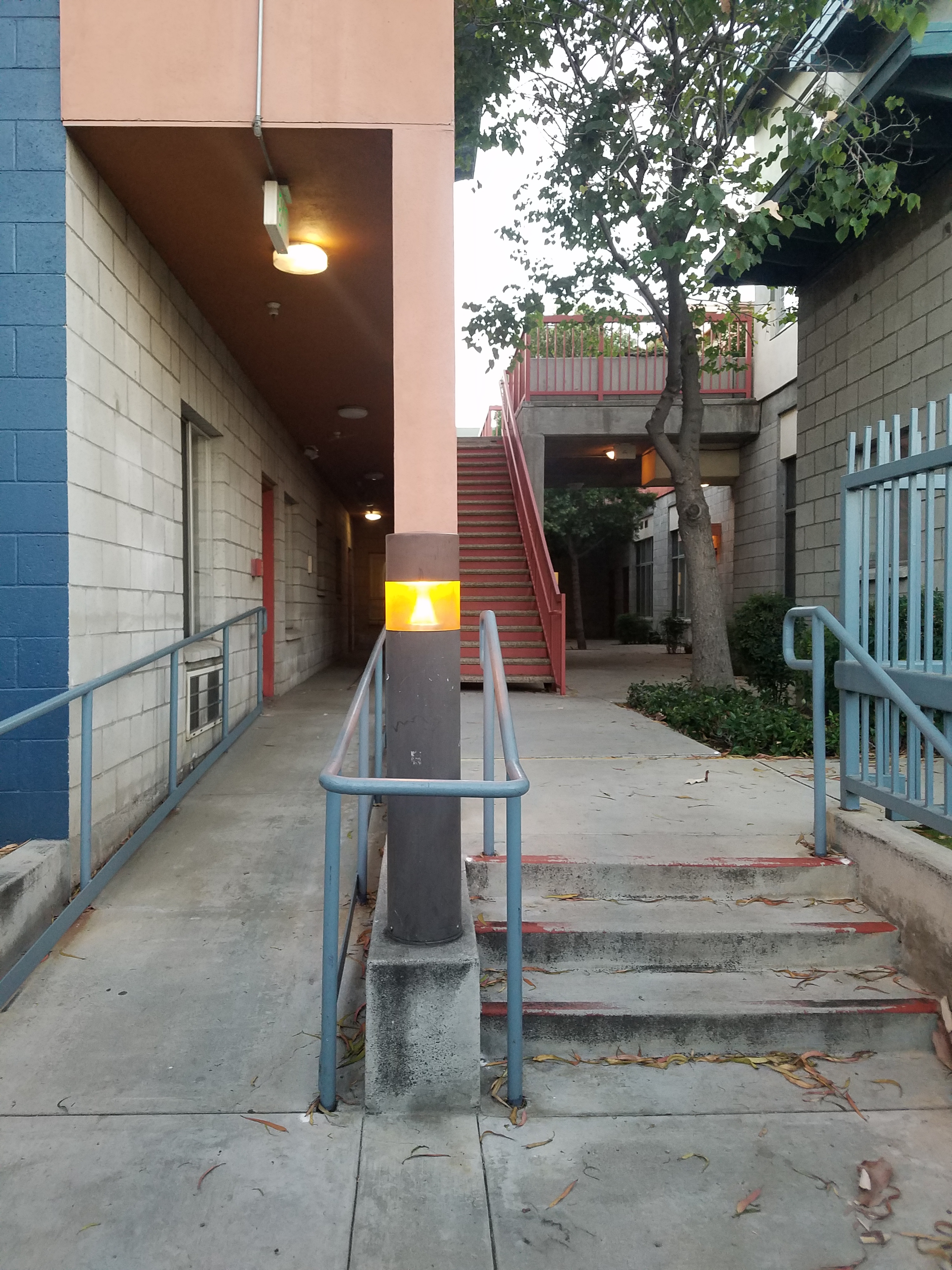 View of Parthenia Court entrance. Accessible ramp and small steps leading uo to building
