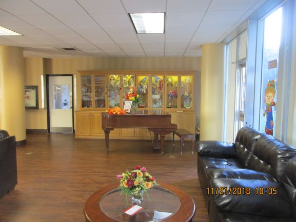 Inside view of the community room equipped with a piano