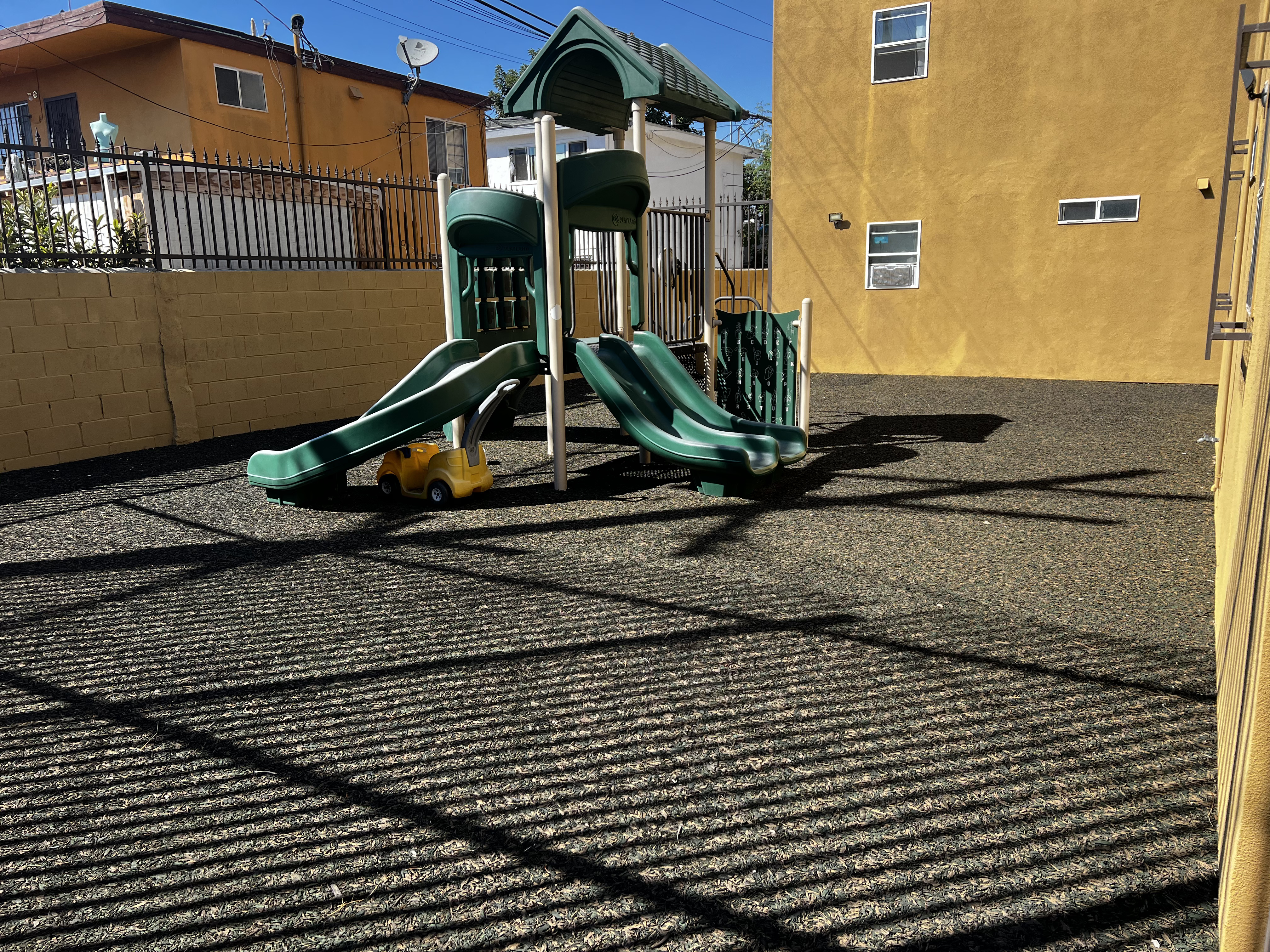 A dark green colored playground