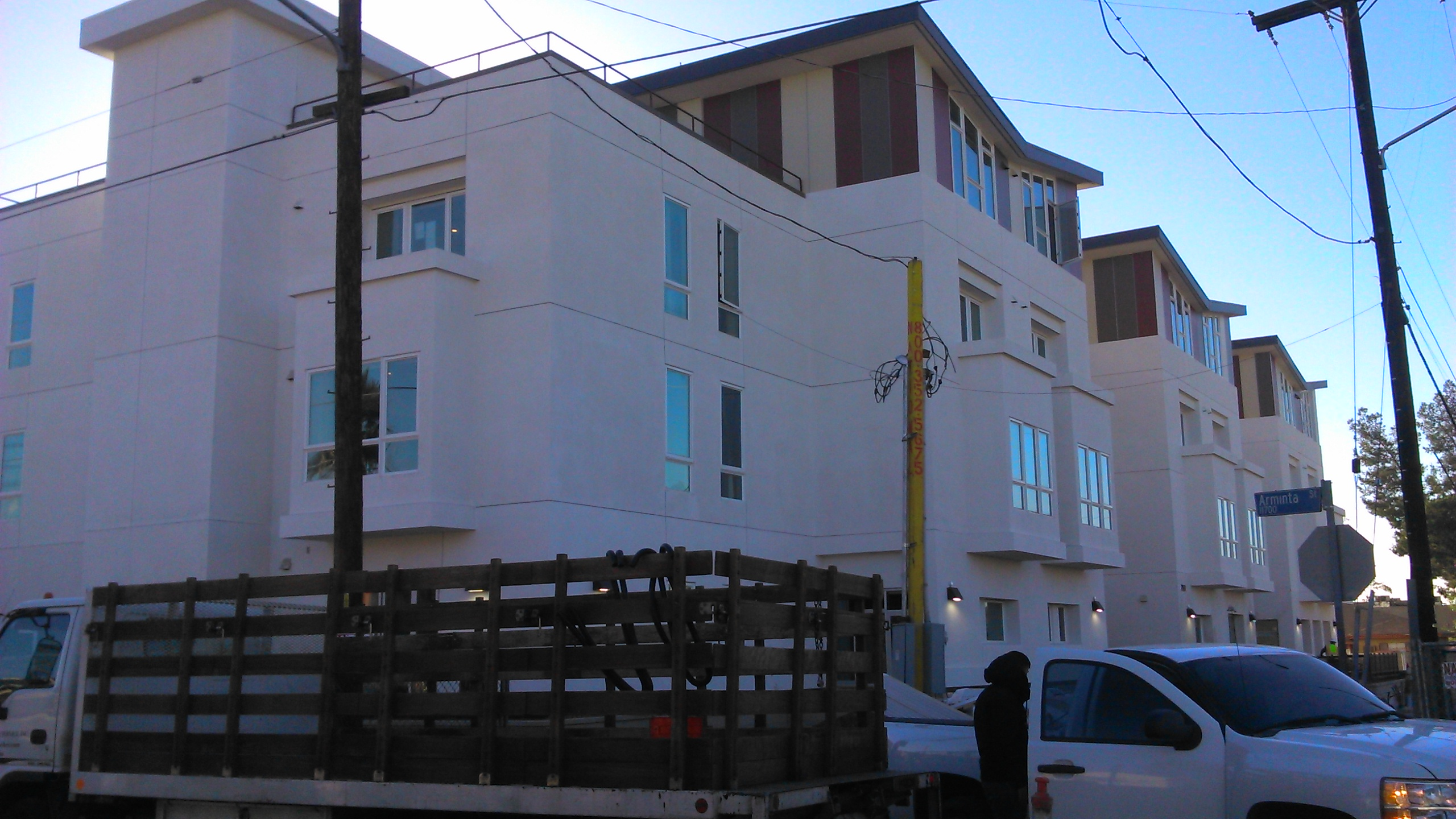 Front view of 2 floor building with a terrace. Truck parked in the front(not part of the unit).