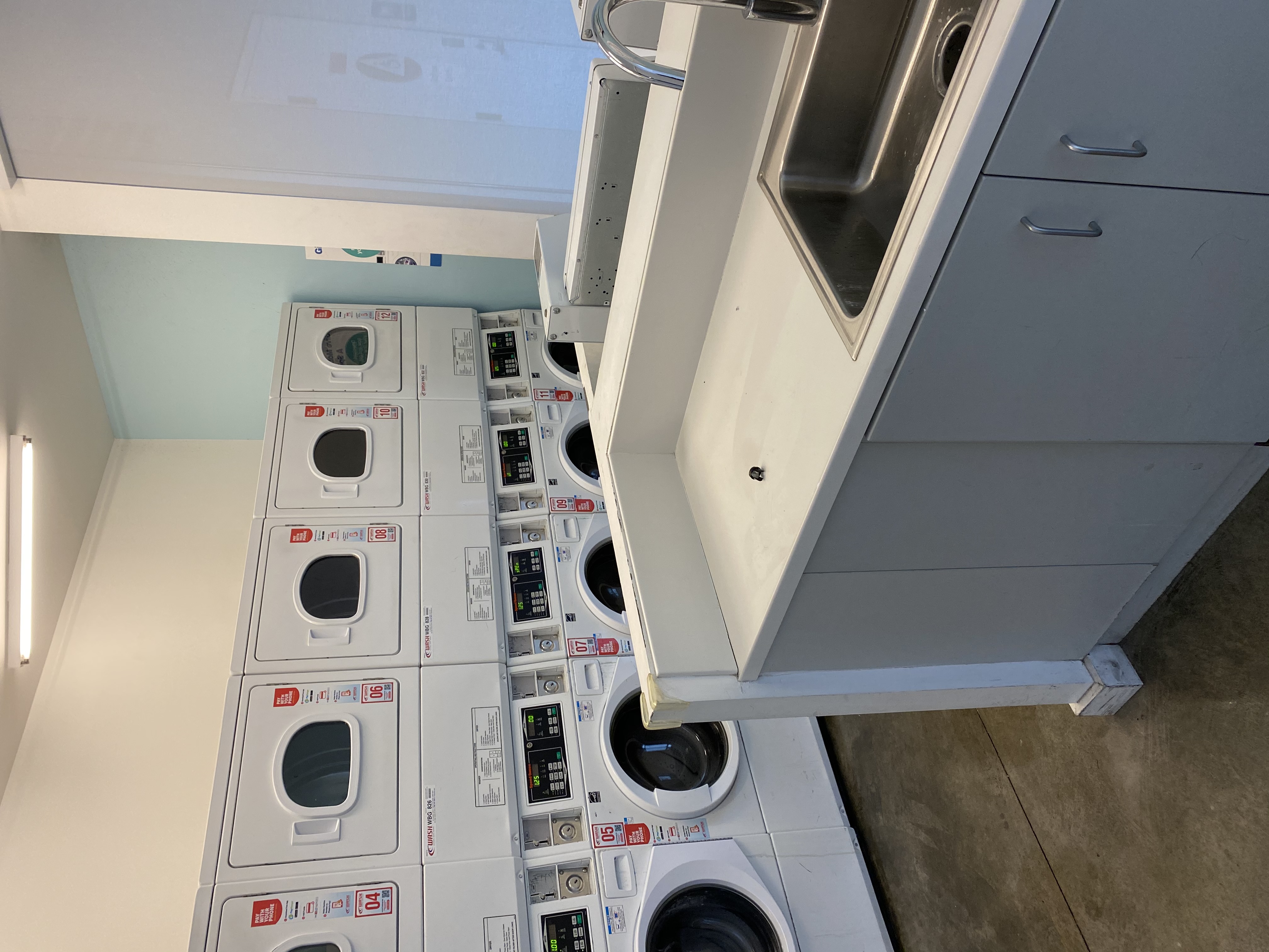 Interior view showing 5 washers and 5 dryers.