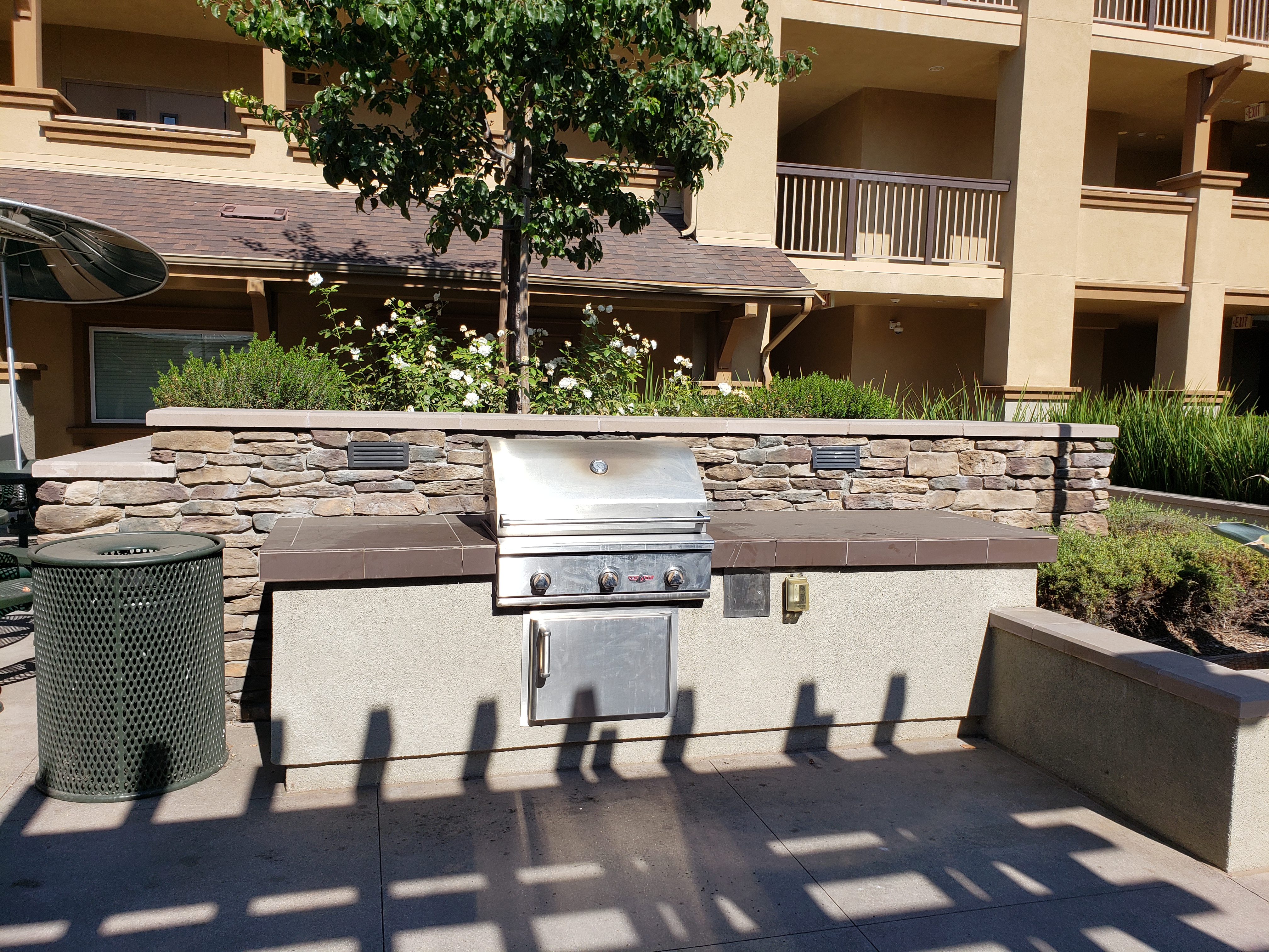 Close-up view of an outside barbeque pit at Broadway Villas