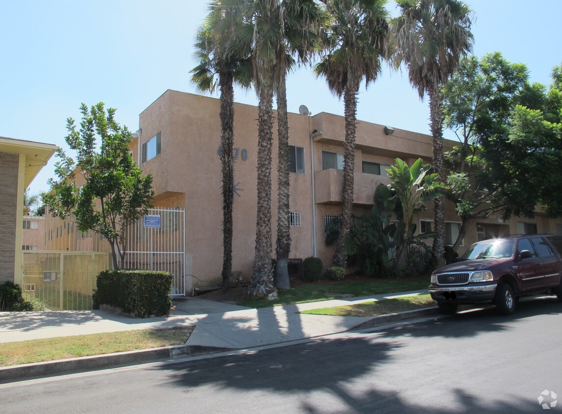 Photo of the Front of Property with Palm Trees.