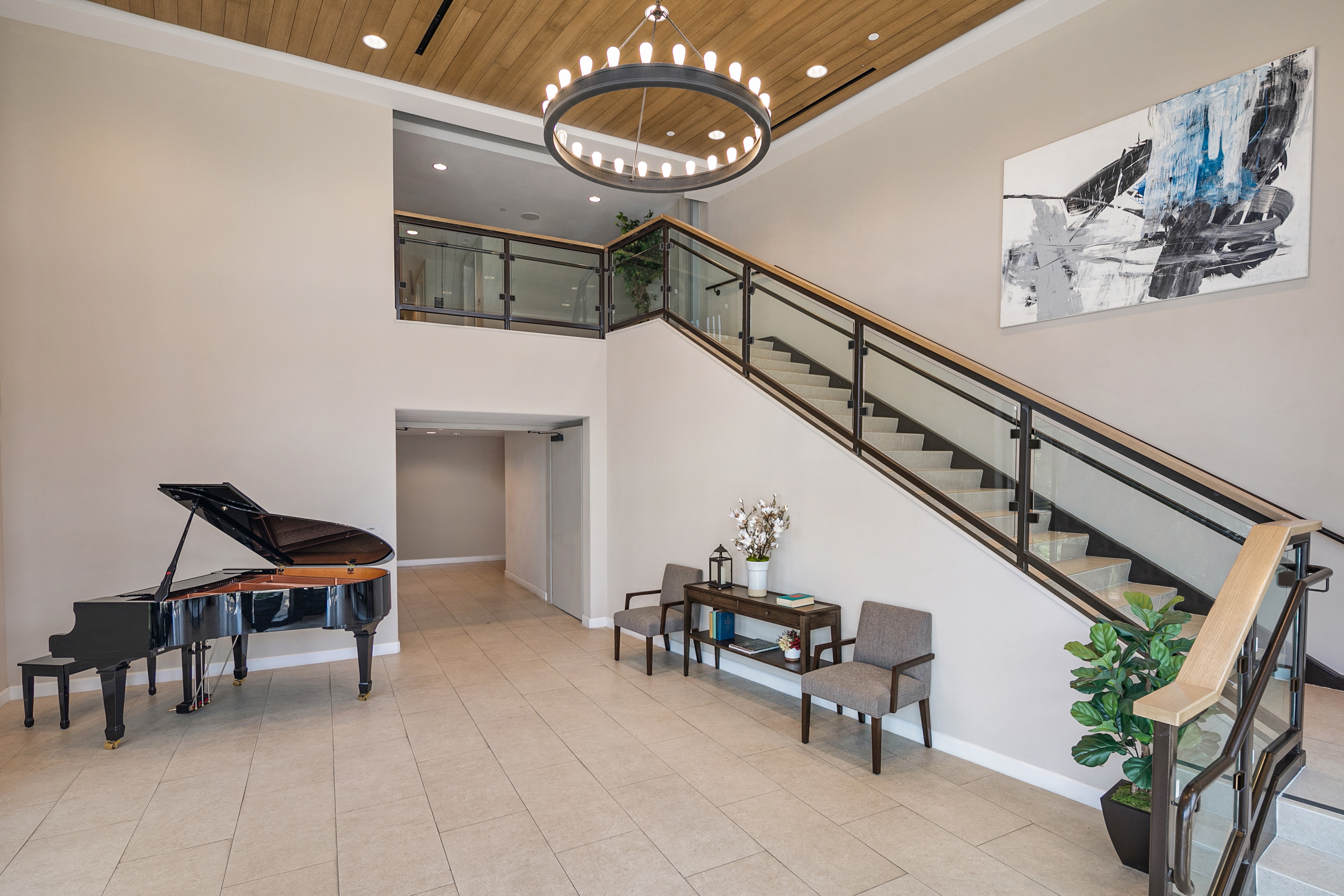Lobby with grand piano and staircase