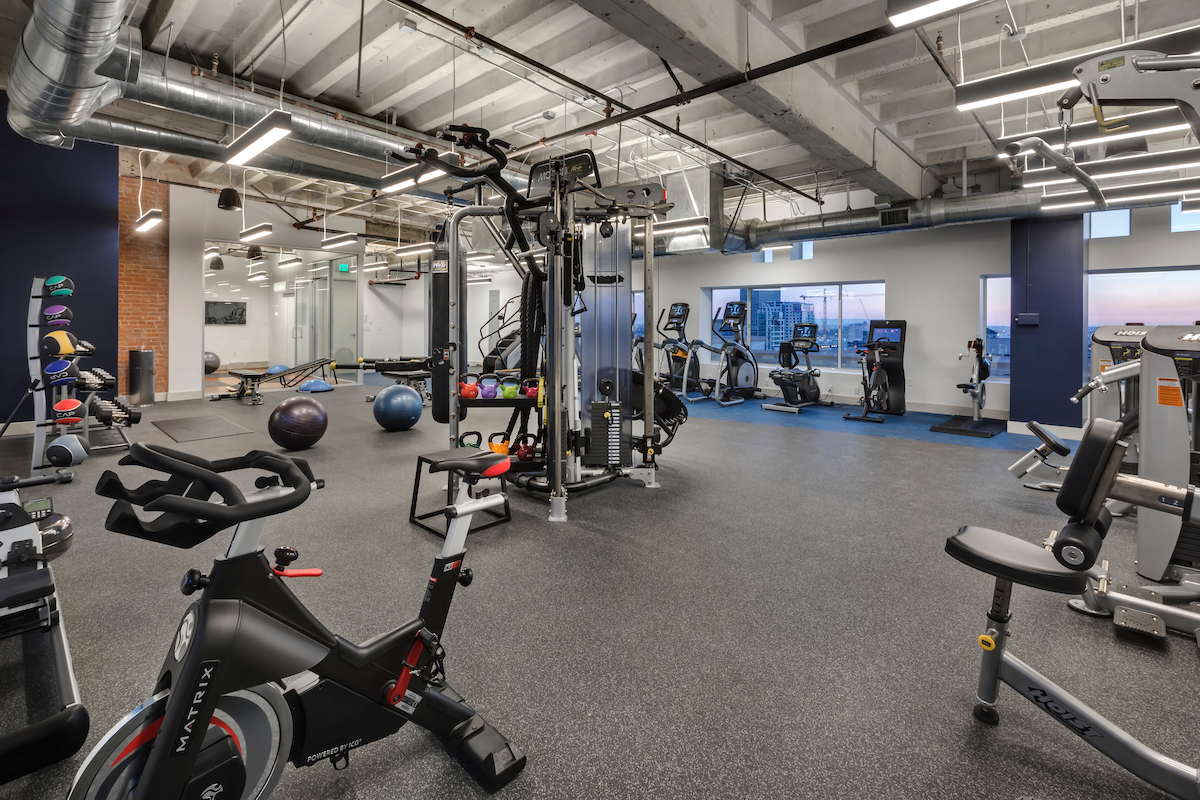 Image of gas company losts community fitness center. large fitness center with several kids of workout machines. There are also exercise balls, medicine balls, and free weights available