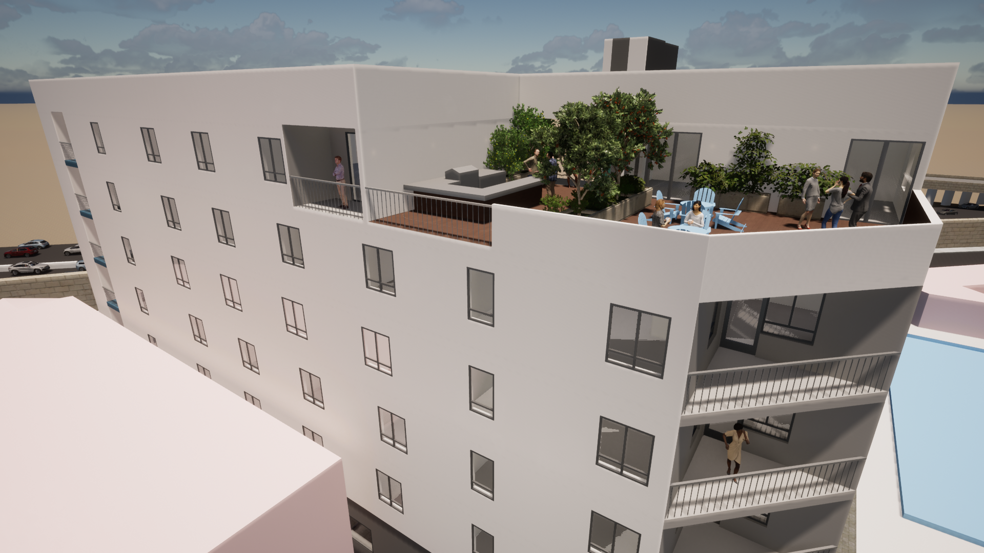 View of rooftop Lounge, people using the provided seating. Unit patios are visible under lounge.