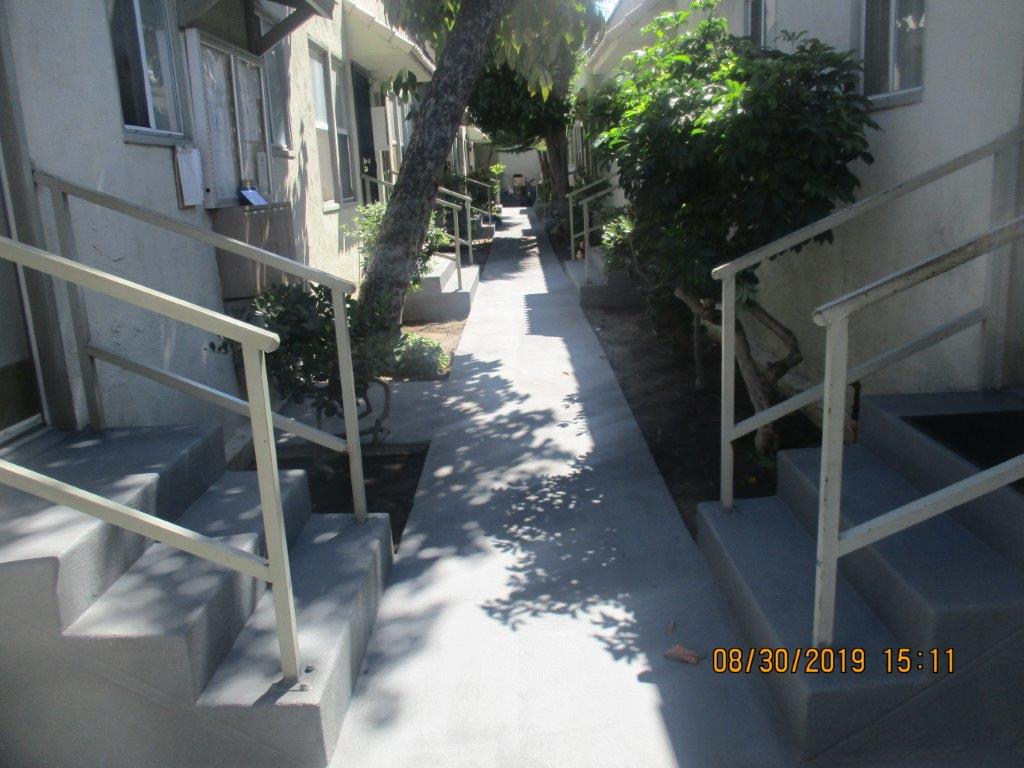 Exterior view of a pathway in between units at the property.
