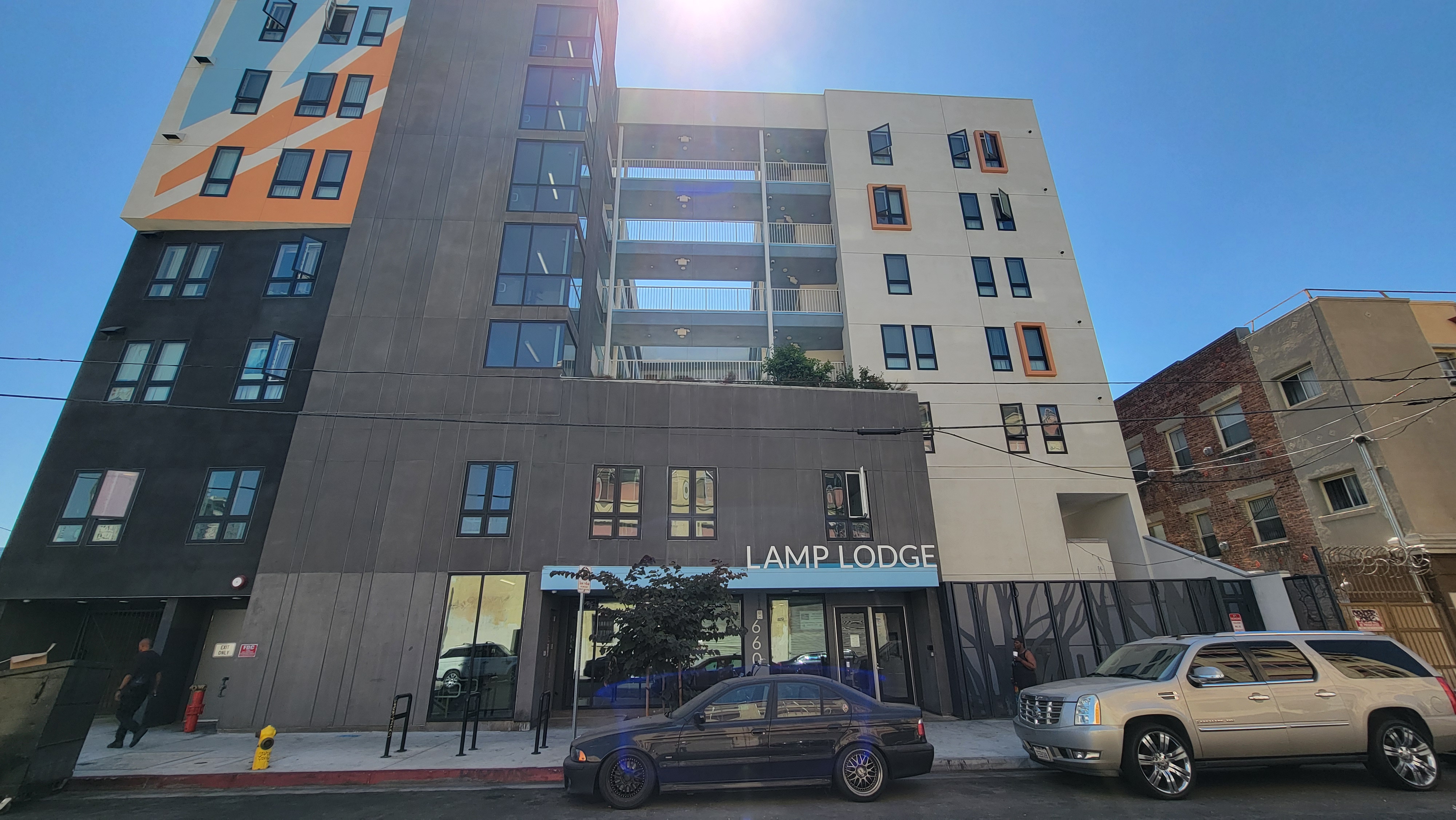 Street view of front of the building. Entrance has glass doors.