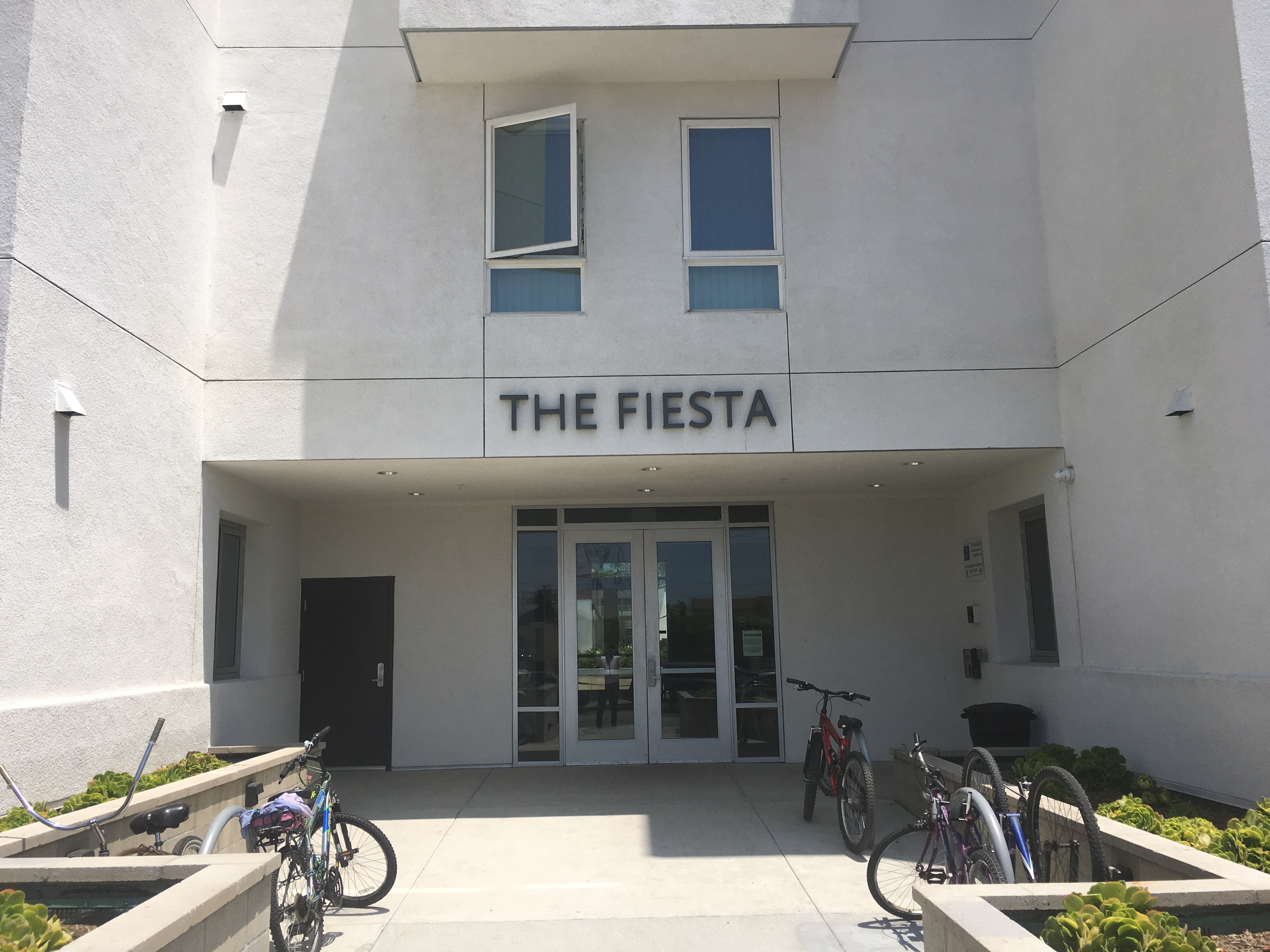 Front entrance of building with The Fiesta written on the top