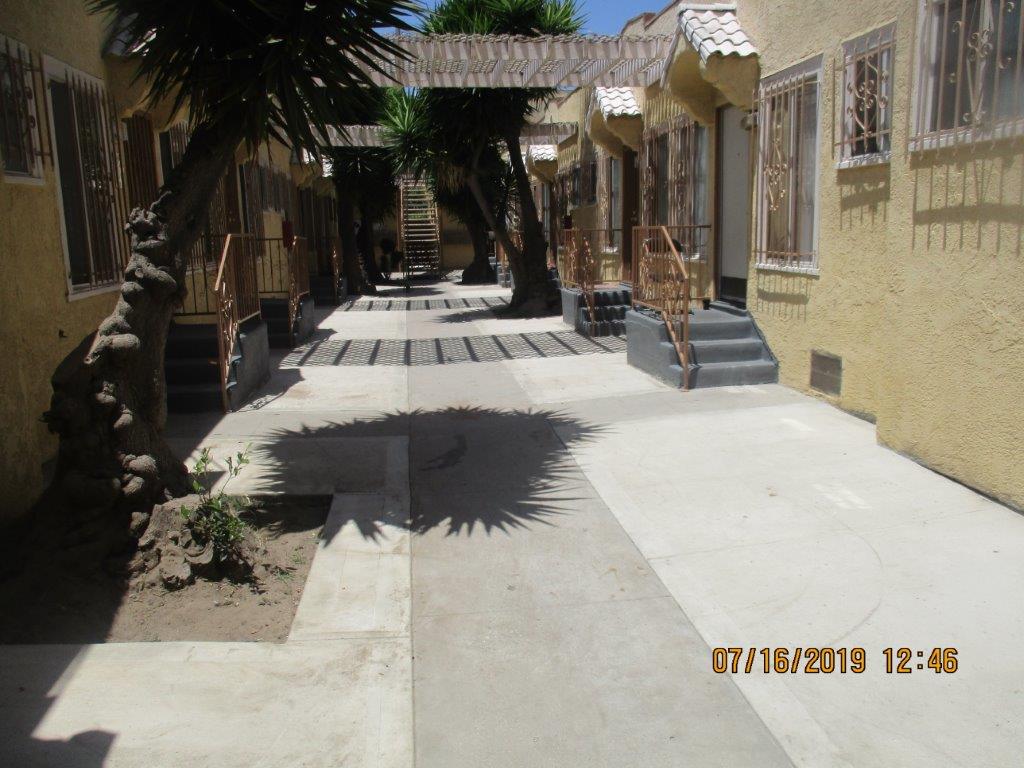 View of pathway in between units on property.