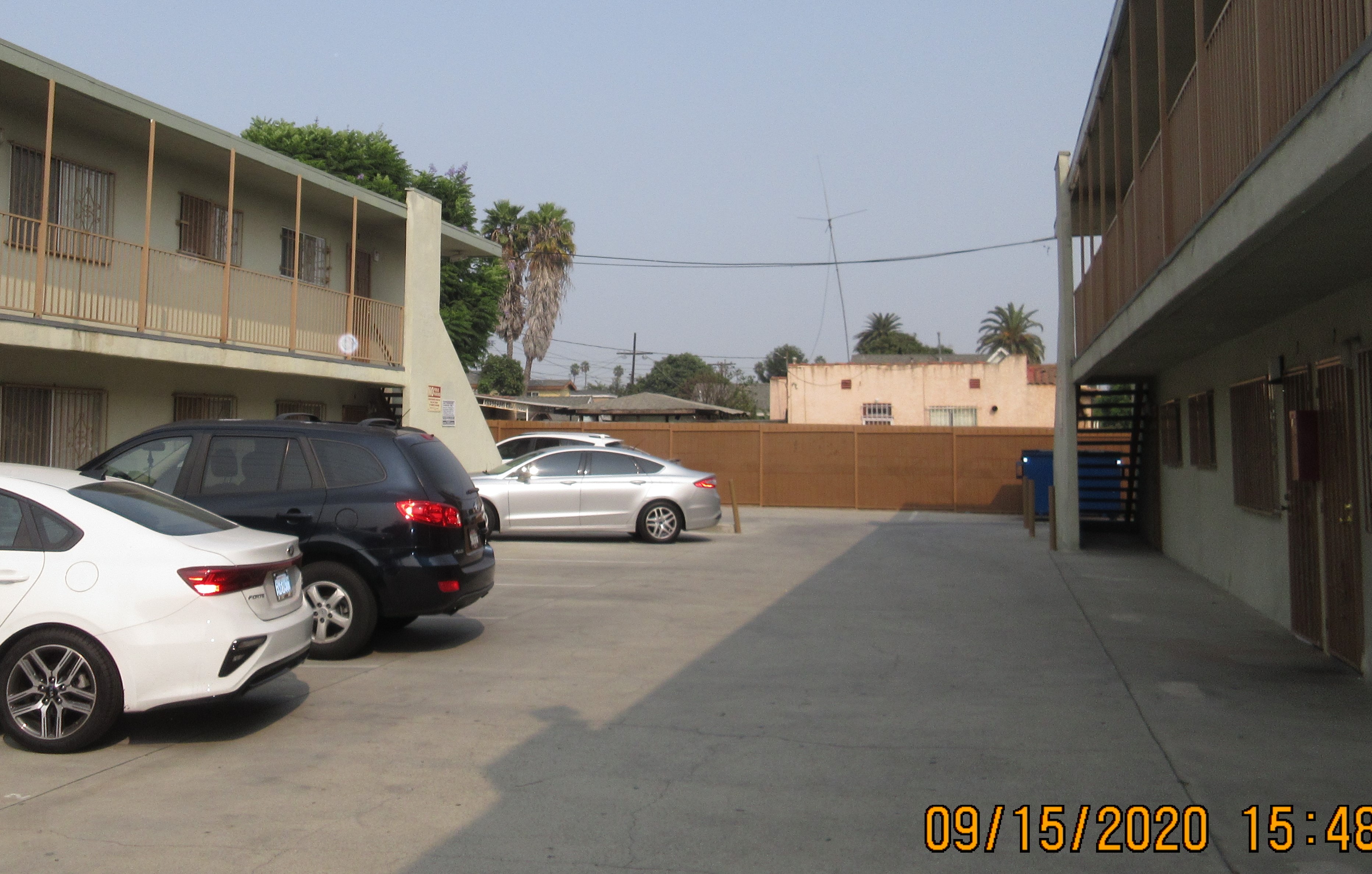 View of an open parking, parked cars.