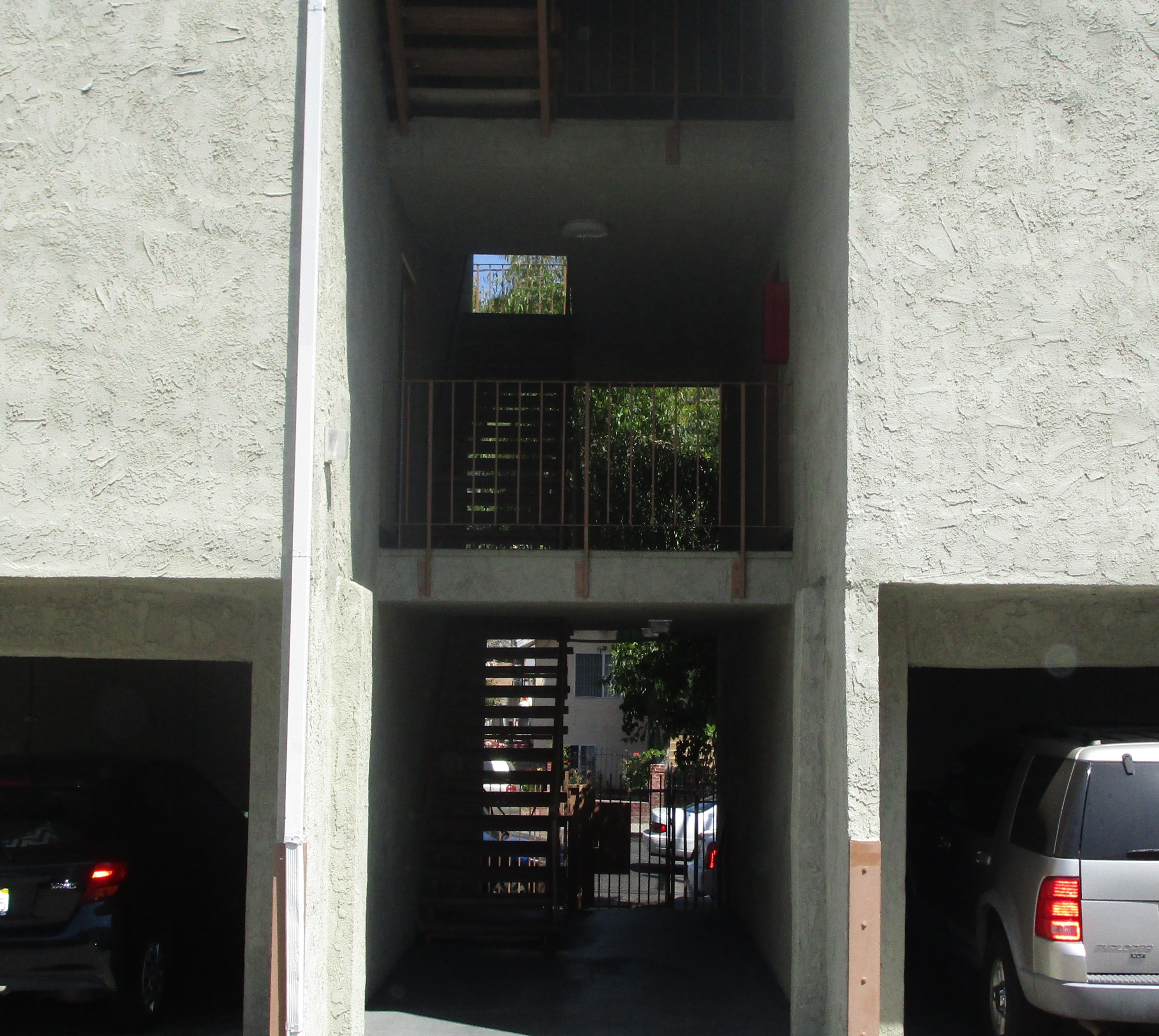 Front view of the parking garage with stairs leading up to the first floor