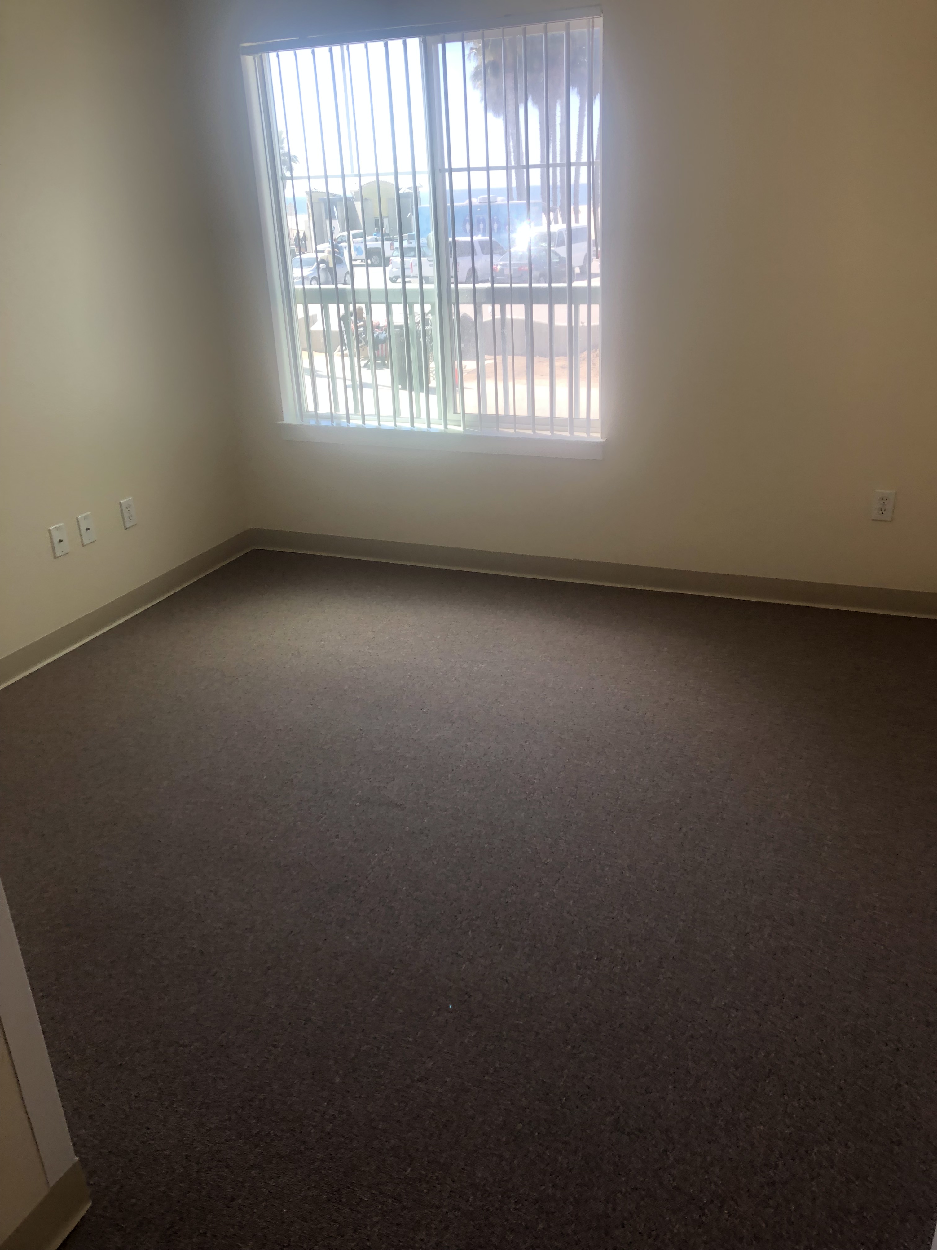 View of bedroom with large window