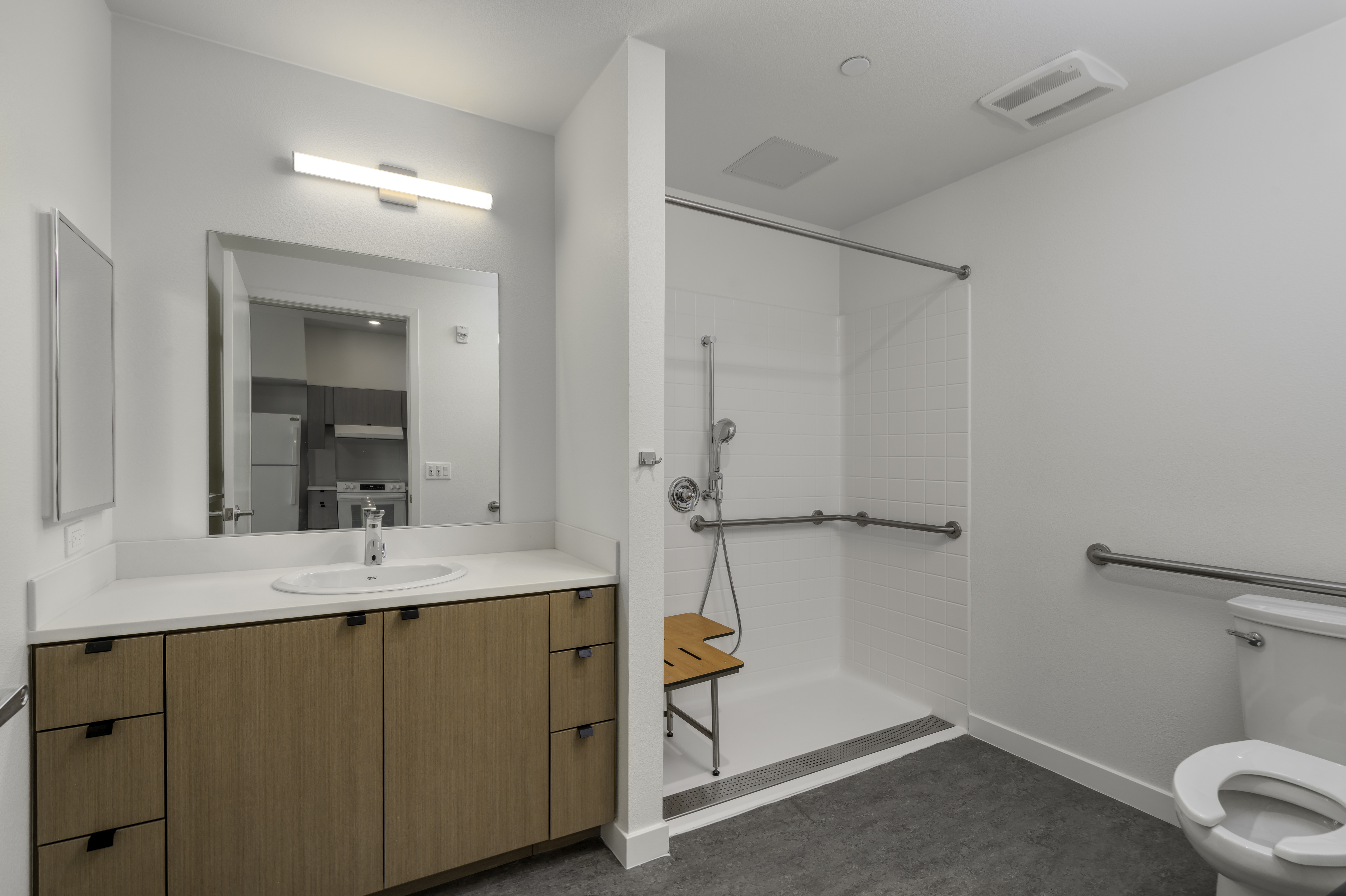 Unit - bathroom.  Sink, toilet, and walk in shower.