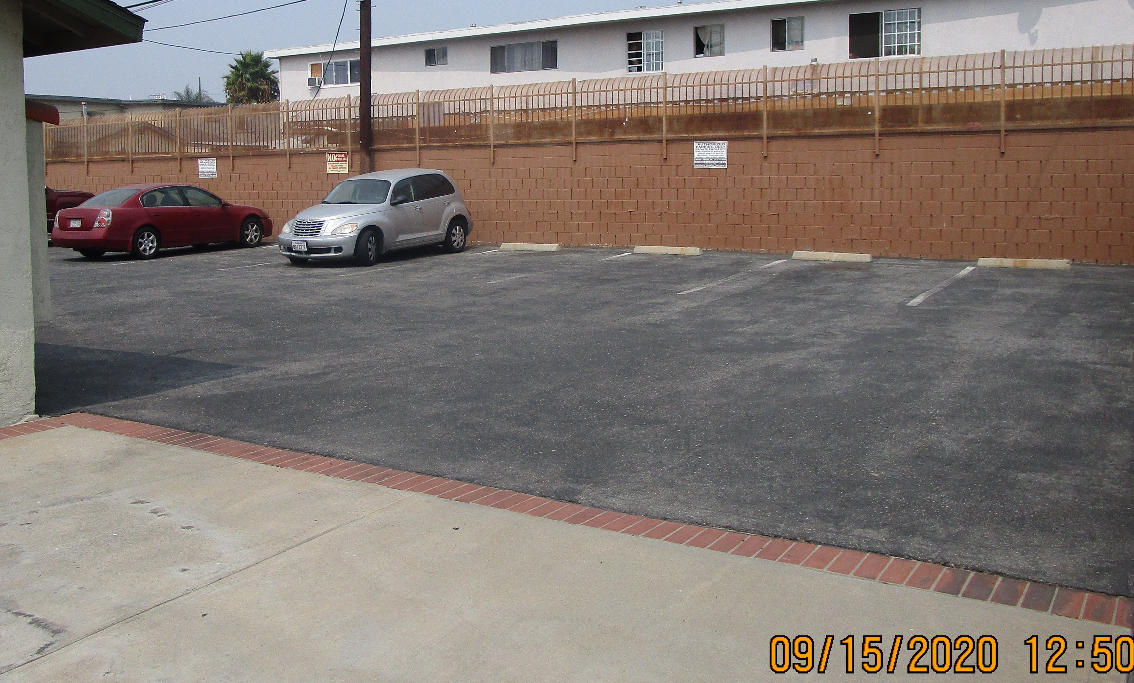 View of an open parking, parked cars.
