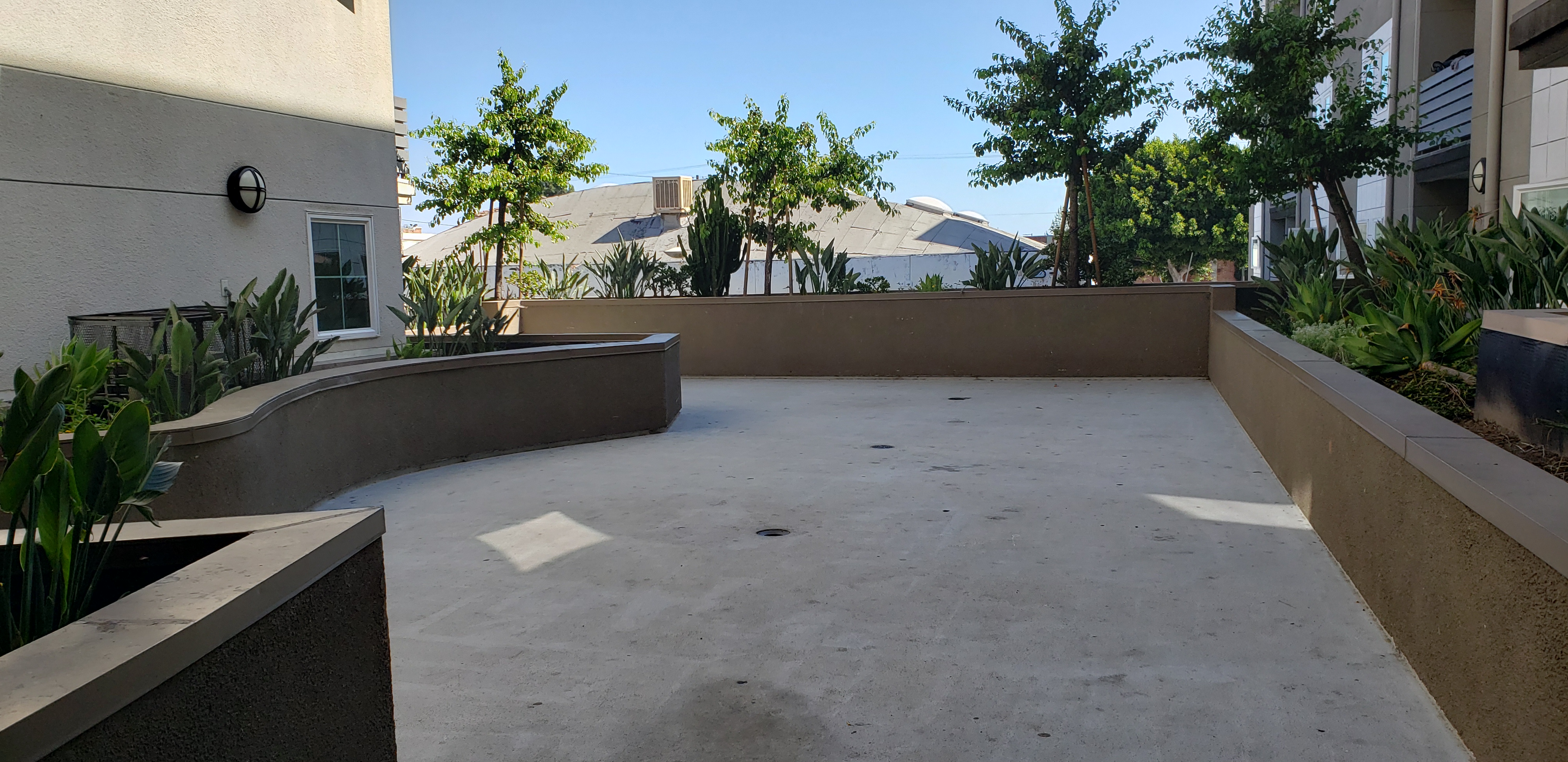Exterior view of a garden rest area of the Menlo Family Housing