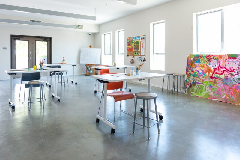 Inside view of an art studio equipped with chairs and painting tools