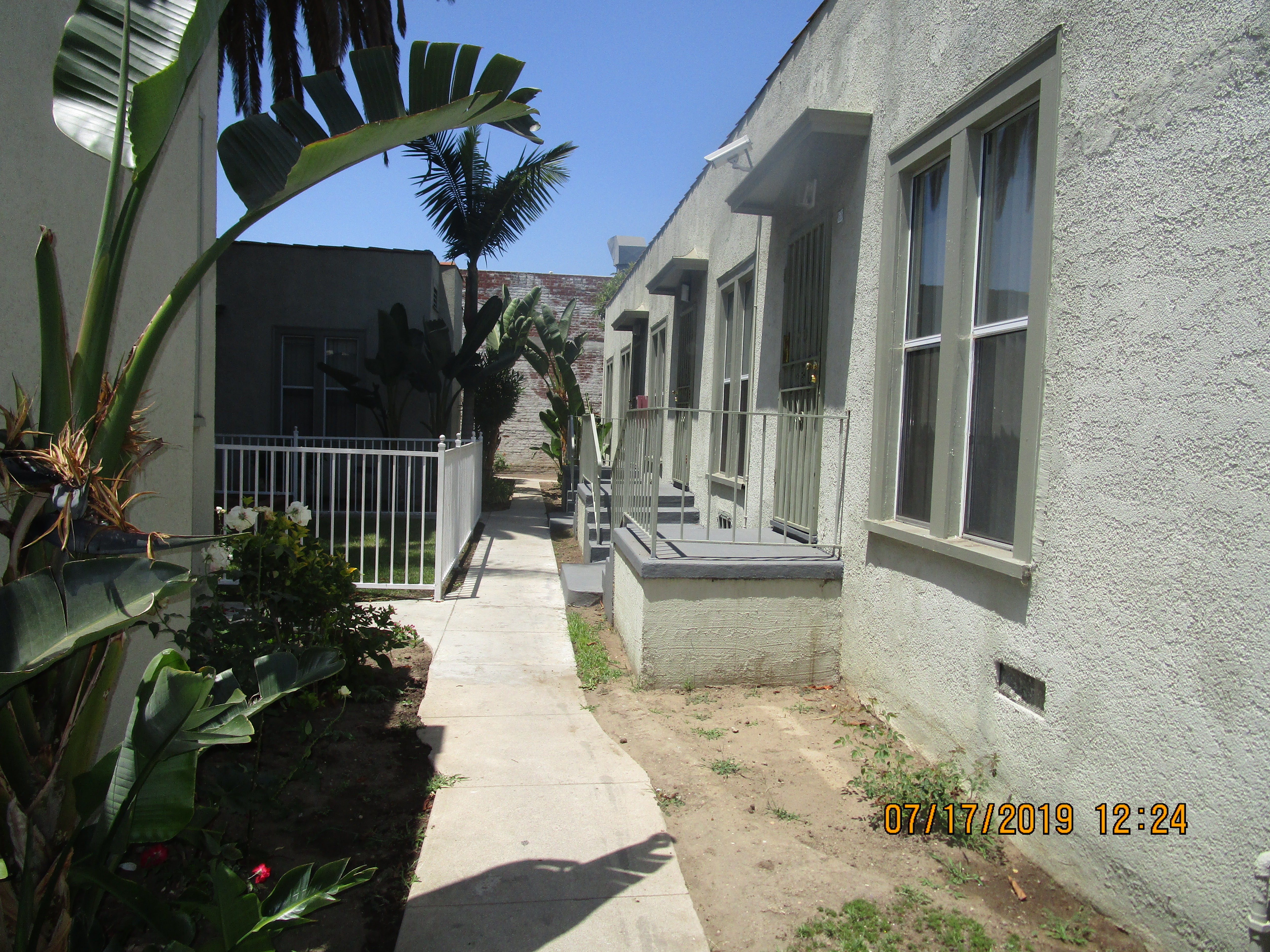 View of pathway in between units on property