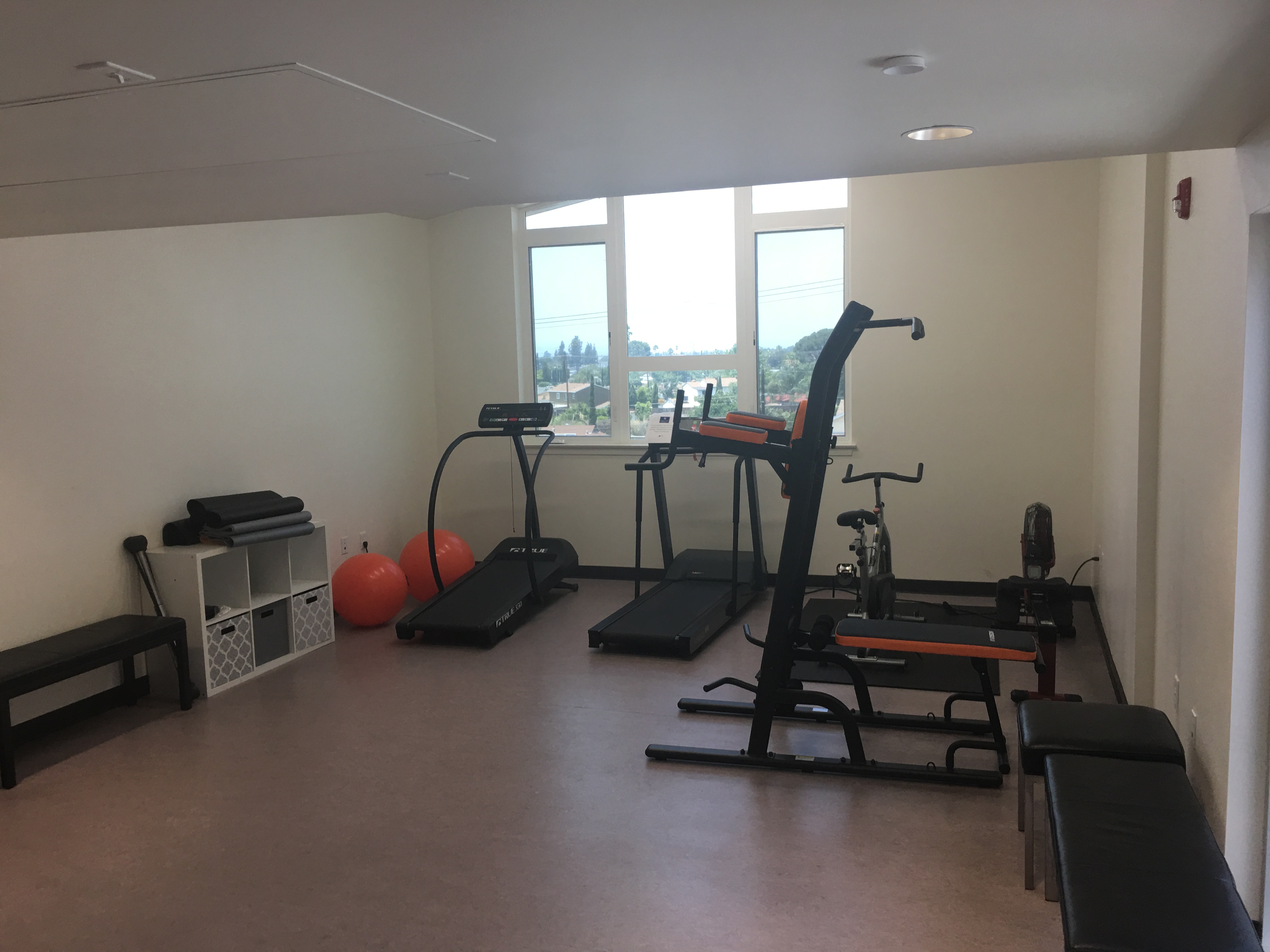 Interior view of the fourth floor Gym in the PSH Campus. With assorted equipment, benches and cubbies