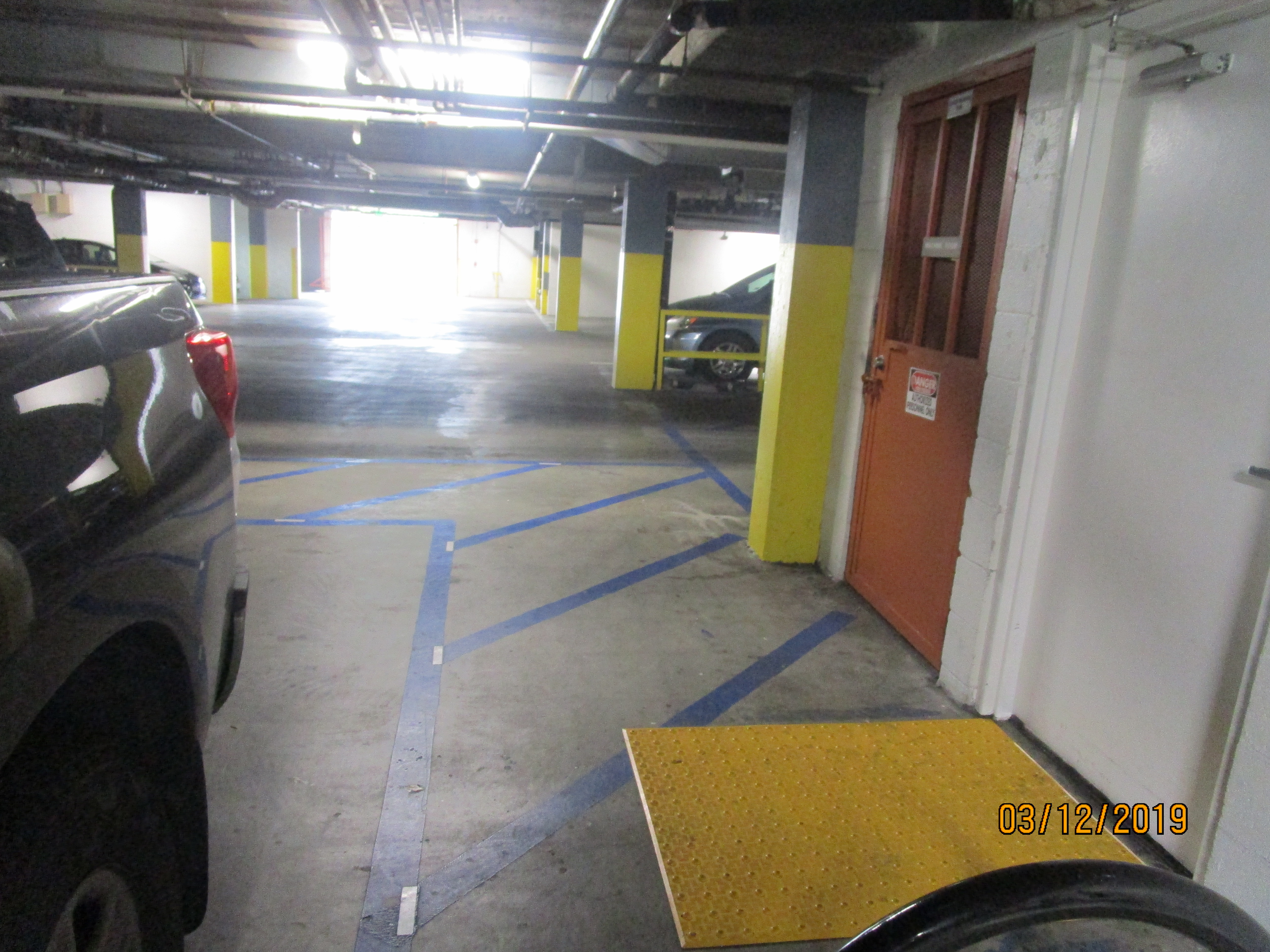 Vies of an underground garage, parked cars.