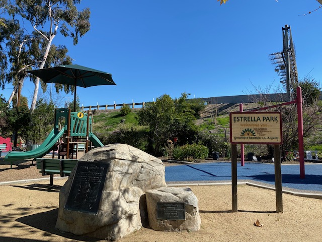 Estrella Park, which is across the street from La Estrella Apartments. The park has picnic tables and children's play area.