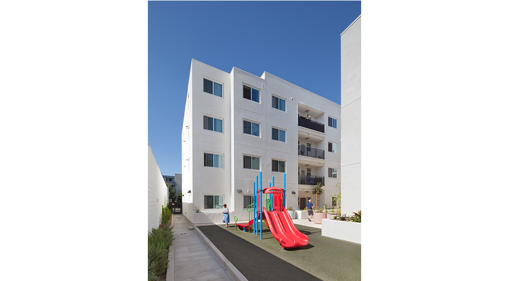 Image of a playground with a building in the background