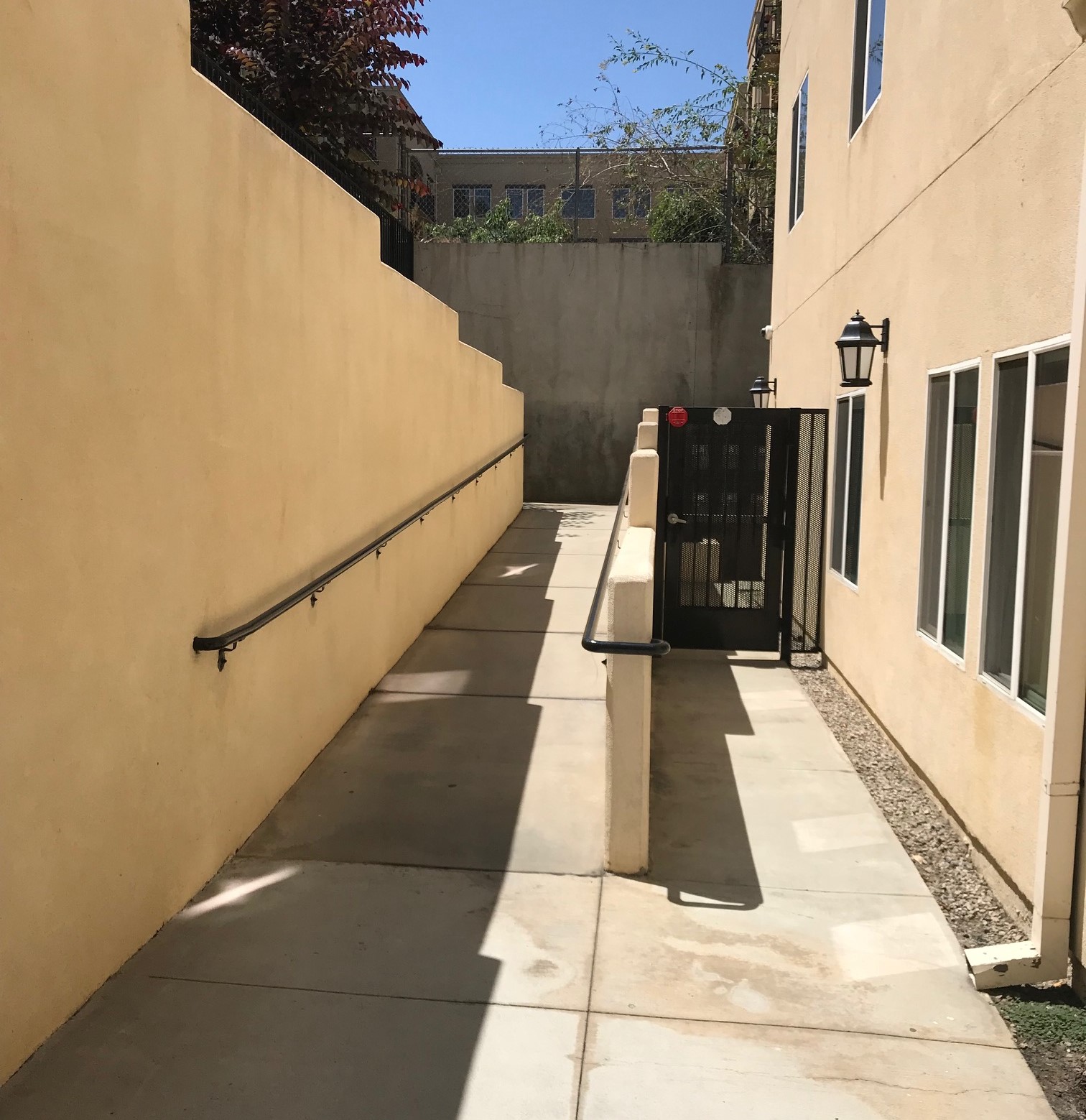 Exterior view of the a ramp leading to a gated entrance to Lorena Terrace.