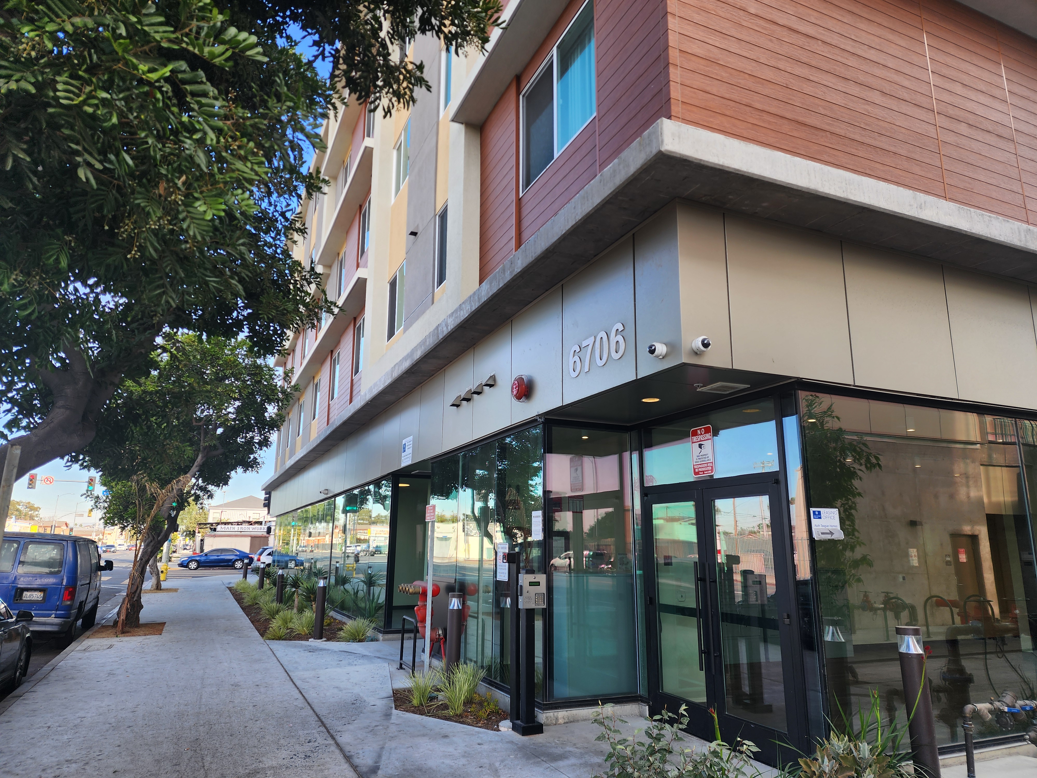 Photo of Bldg exterior and unit kitchen