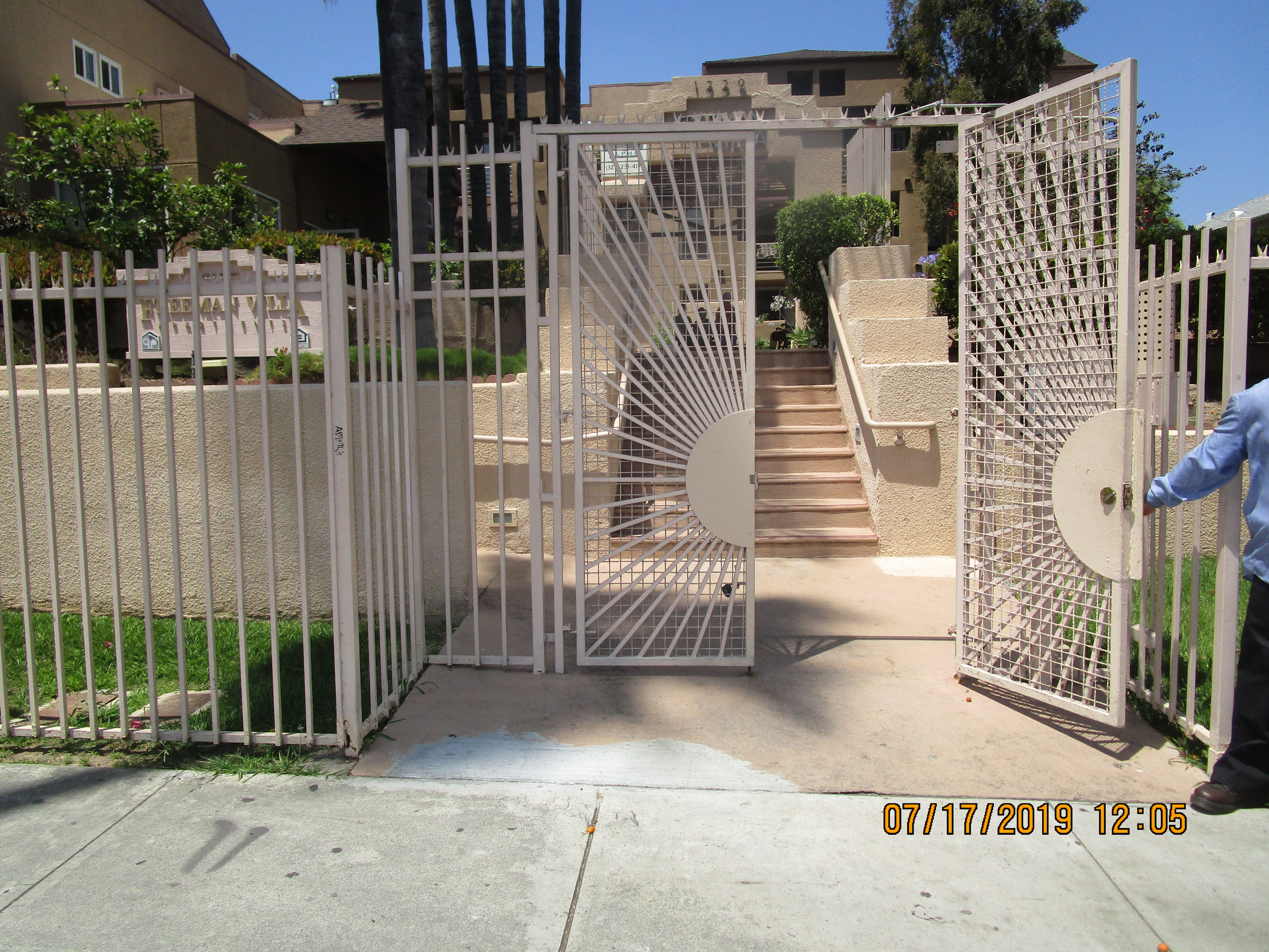 Exterior view of the gated entrance to Freeman Villas