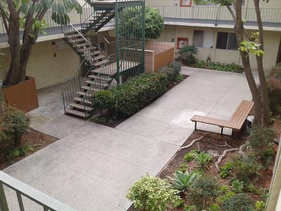 Exterior view of a common area in the center of the building with stairs leading to all levels of Ingram Preservation Properties