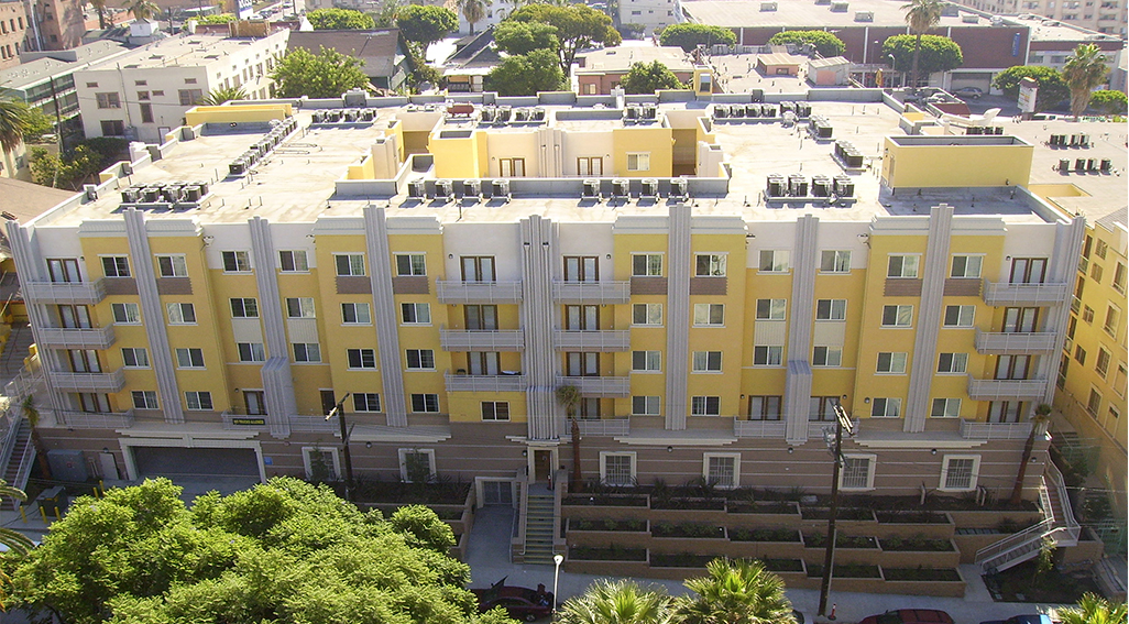 Ariel photo of yellow and grey building