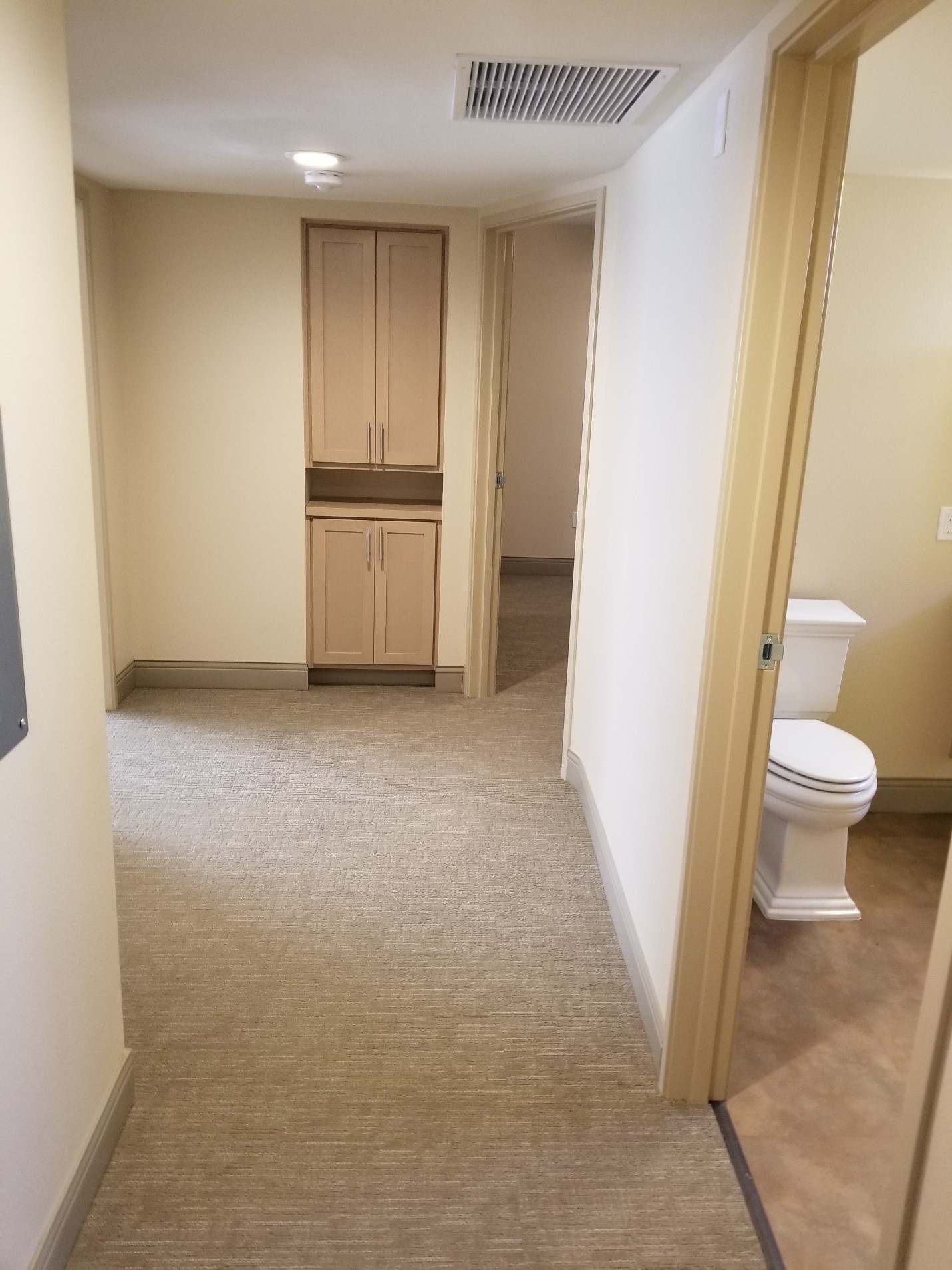 Hallway with accessible cabinets - handles can all be reaching from a wheelchair