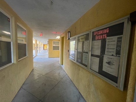 Hallway with bulletin board.