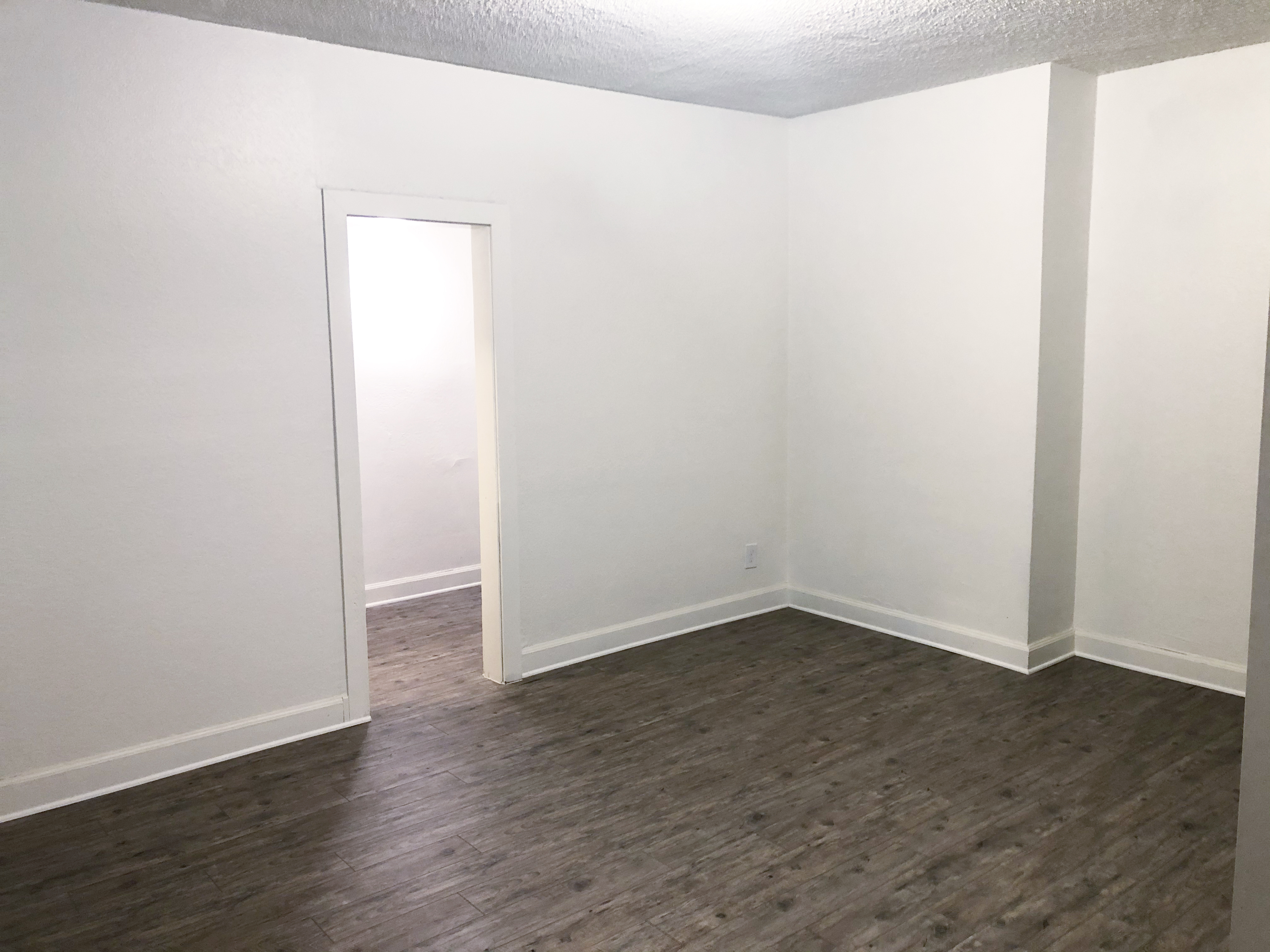 Interior view of an empty bedroom in a unit on the property.